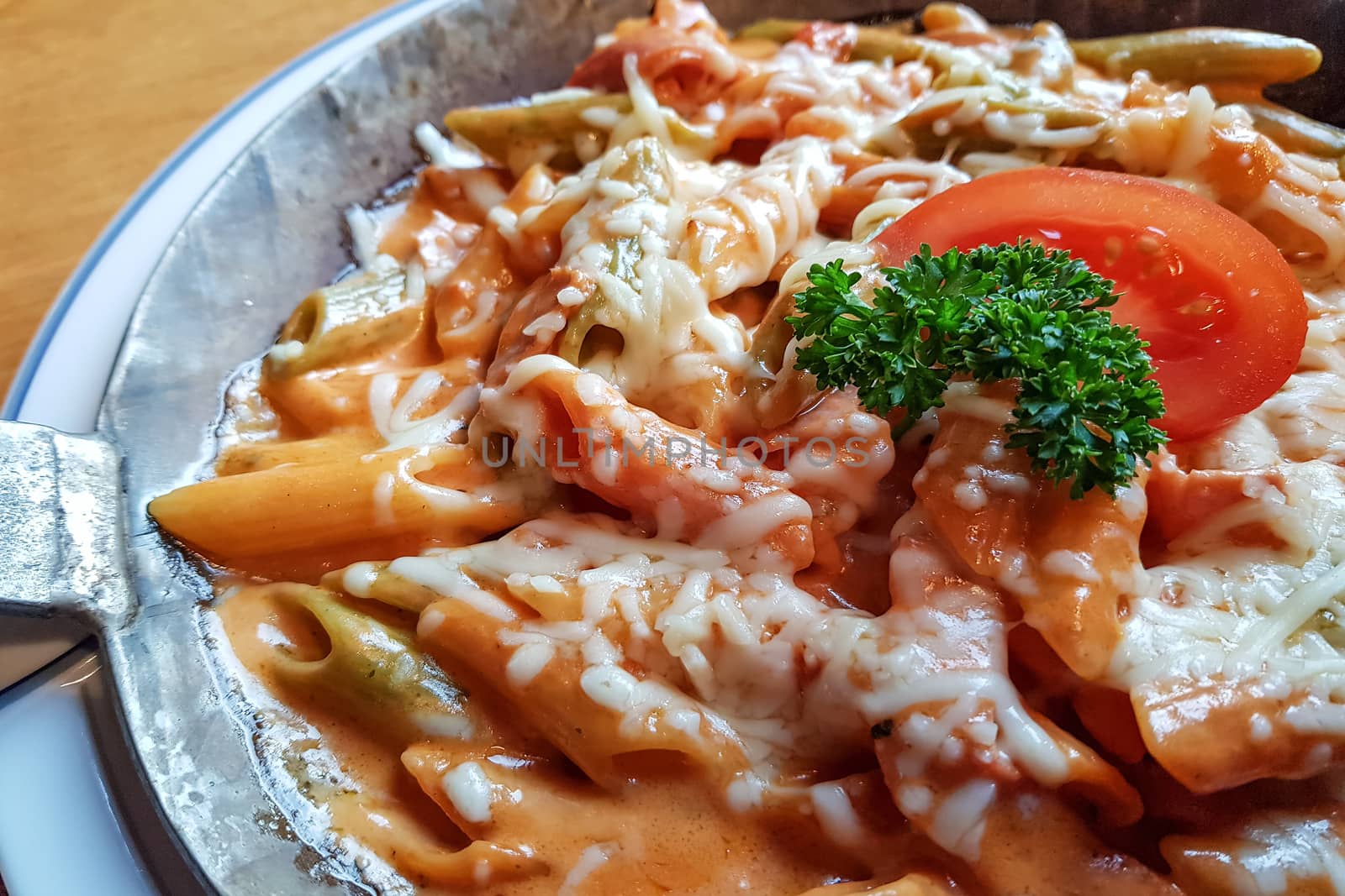 Pasta dish with fresh tomato sauce, mozzarella and basil