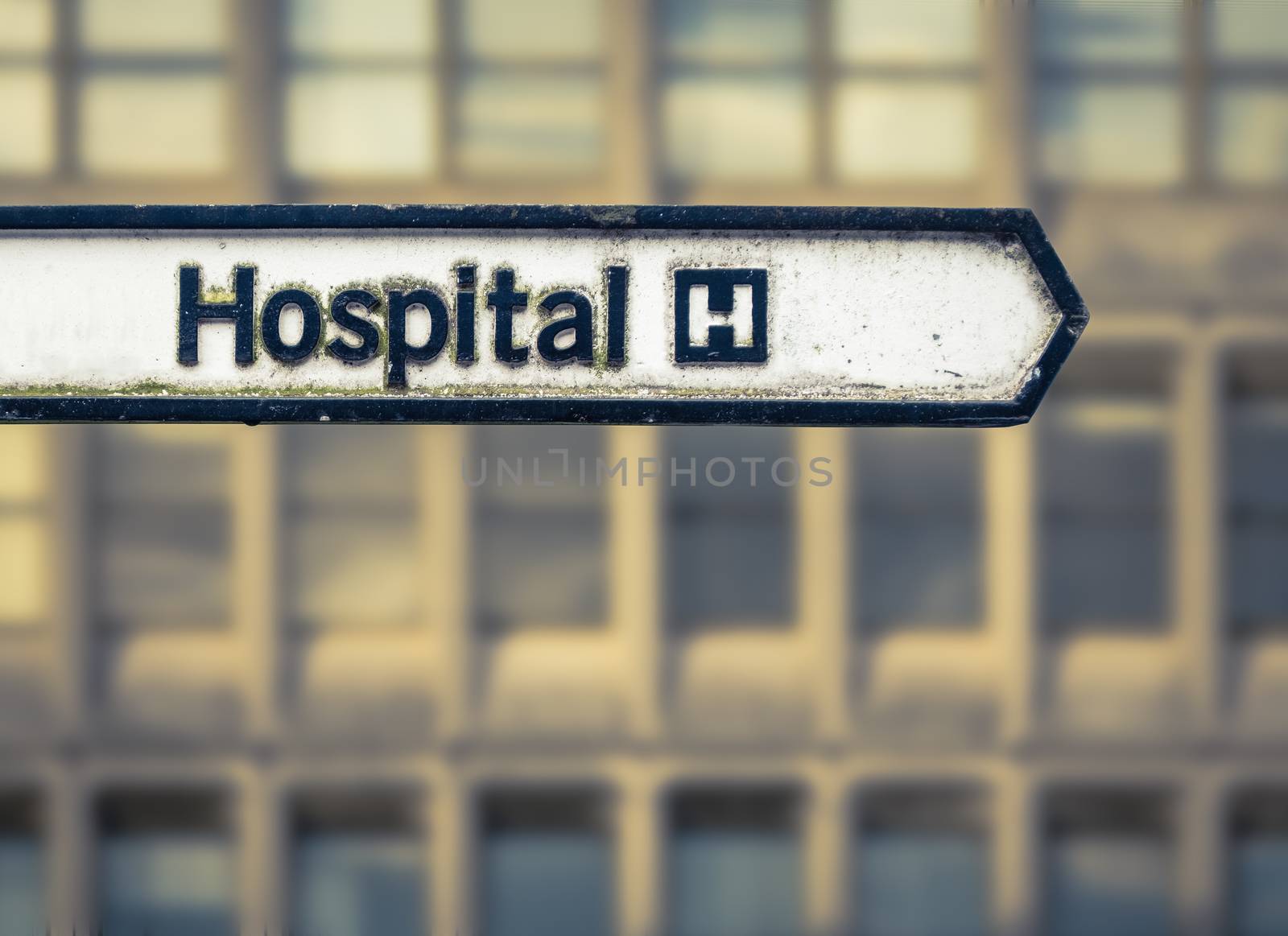 A Grungy Sign For A National Health Service Hospital In An Urban Area In The UK