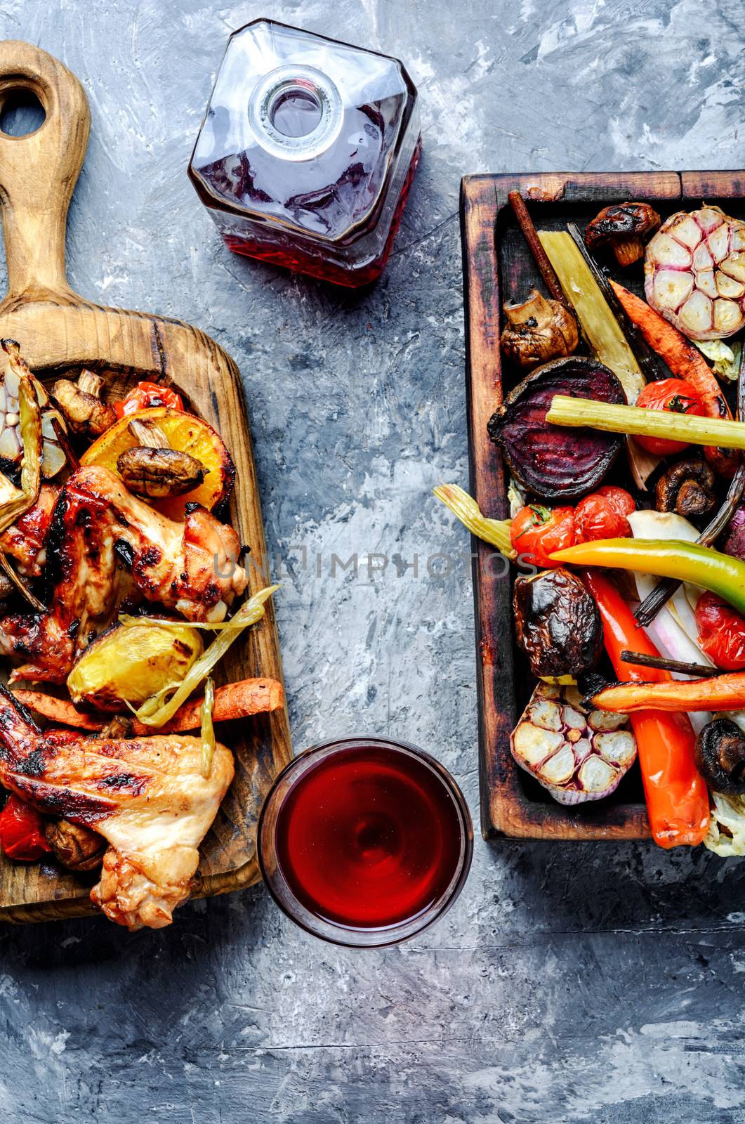 Grilled chicken wings with grilled vegetables.BBQ chicken wings.Summer barbecue