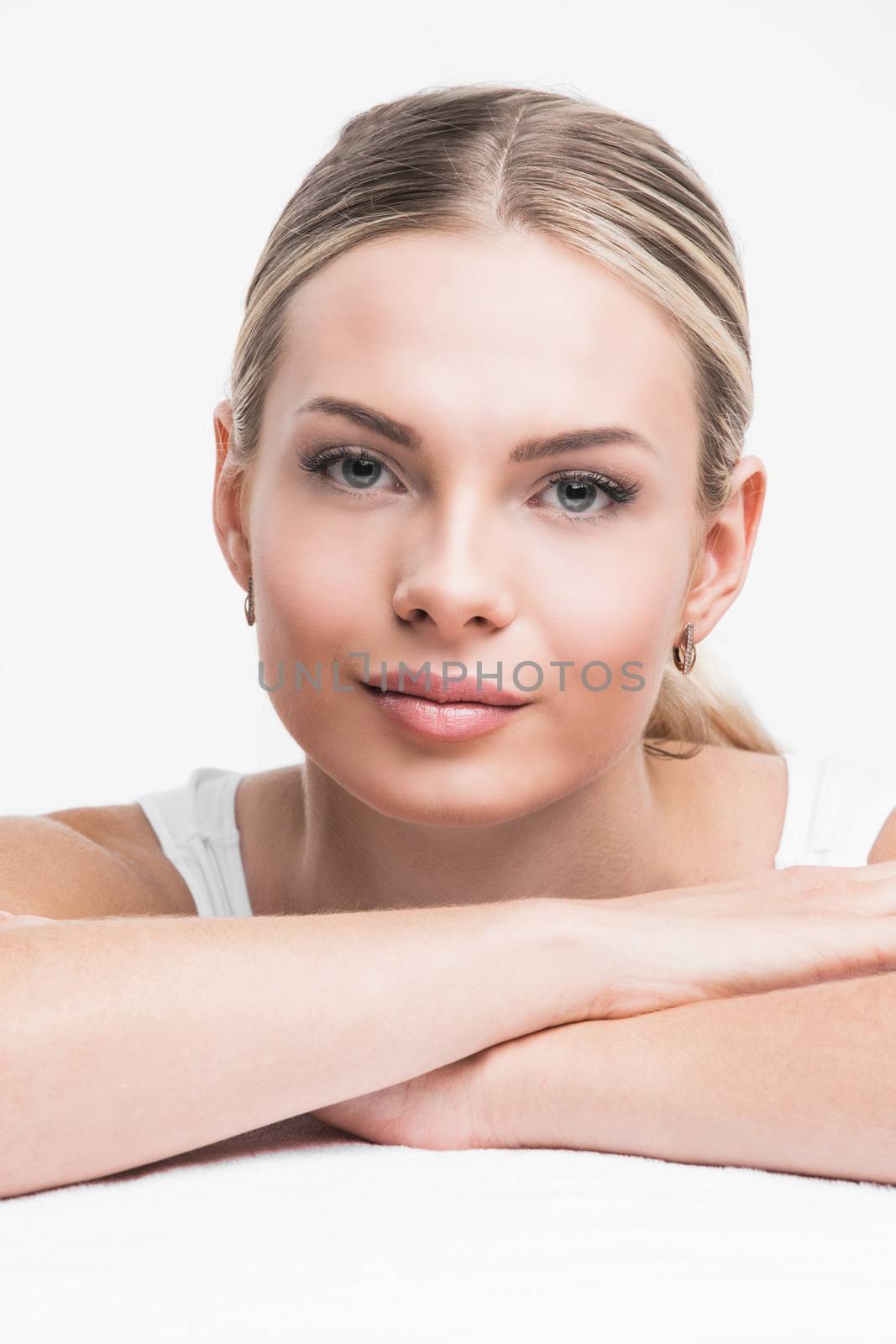 Portrait of young woman with perfect skin isolated on white background