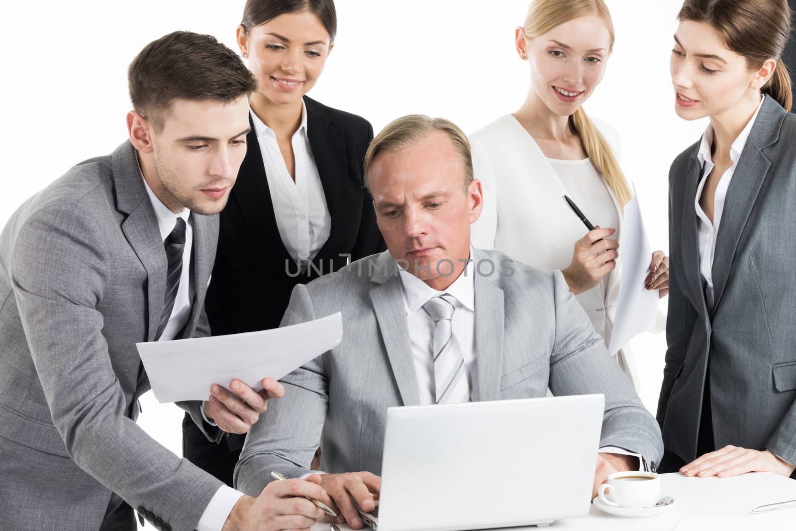 Business team working with laptop and documents together