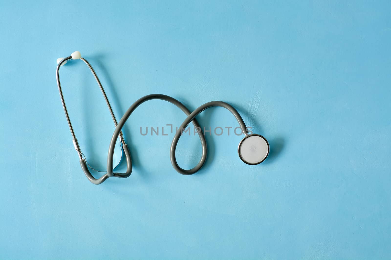 Stethoscope isoleted on the light blue background. by nixrenas