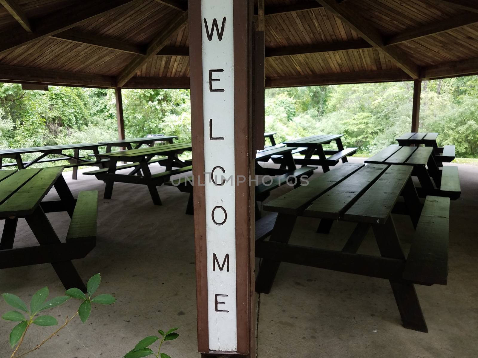 welcome sign on picnic pavilion with tables by stockphotofan1