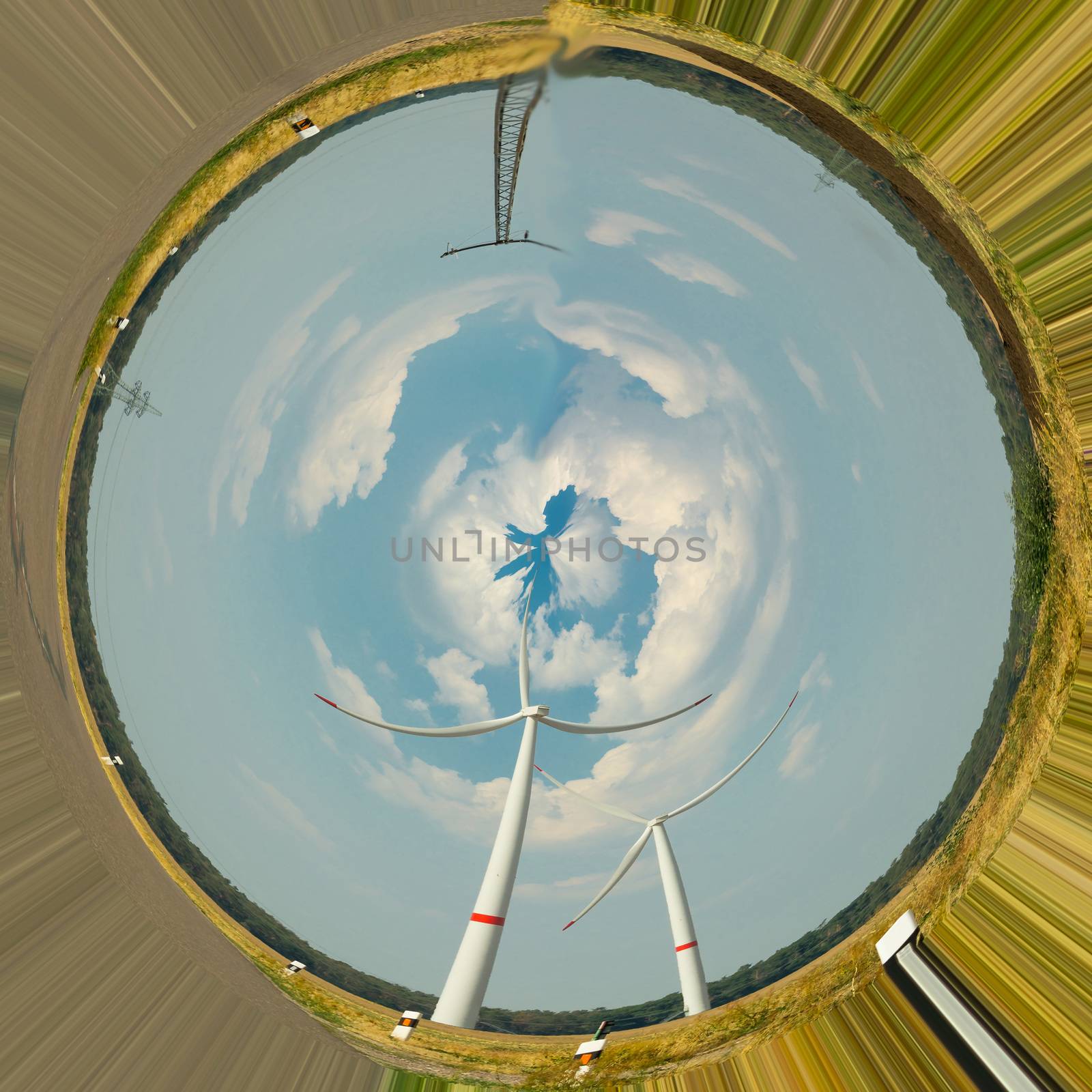 Wind turbines for renewable energies. Photo effect with distortion filter in front of blue sky
