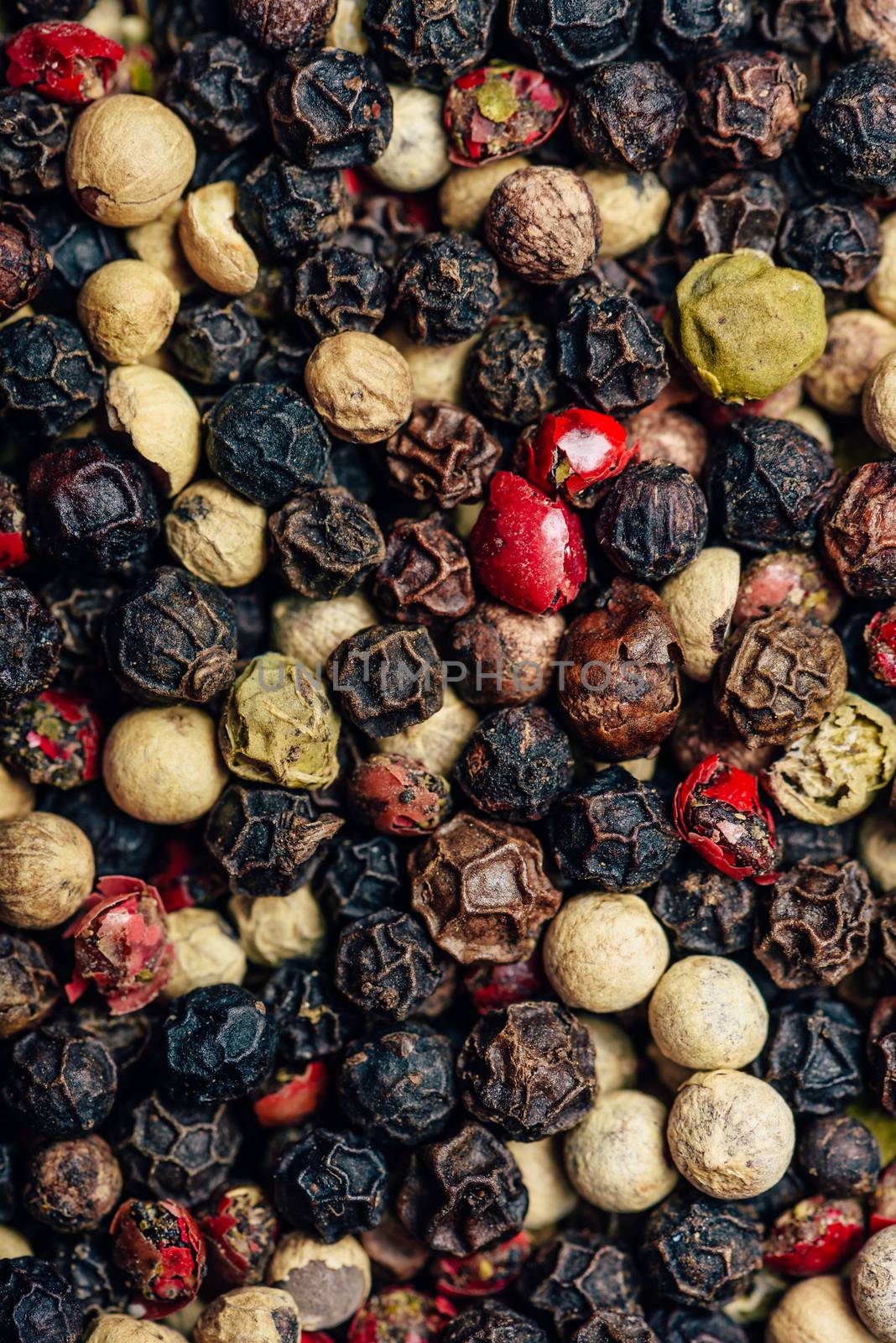 Background of different color peppercorn. View from above.