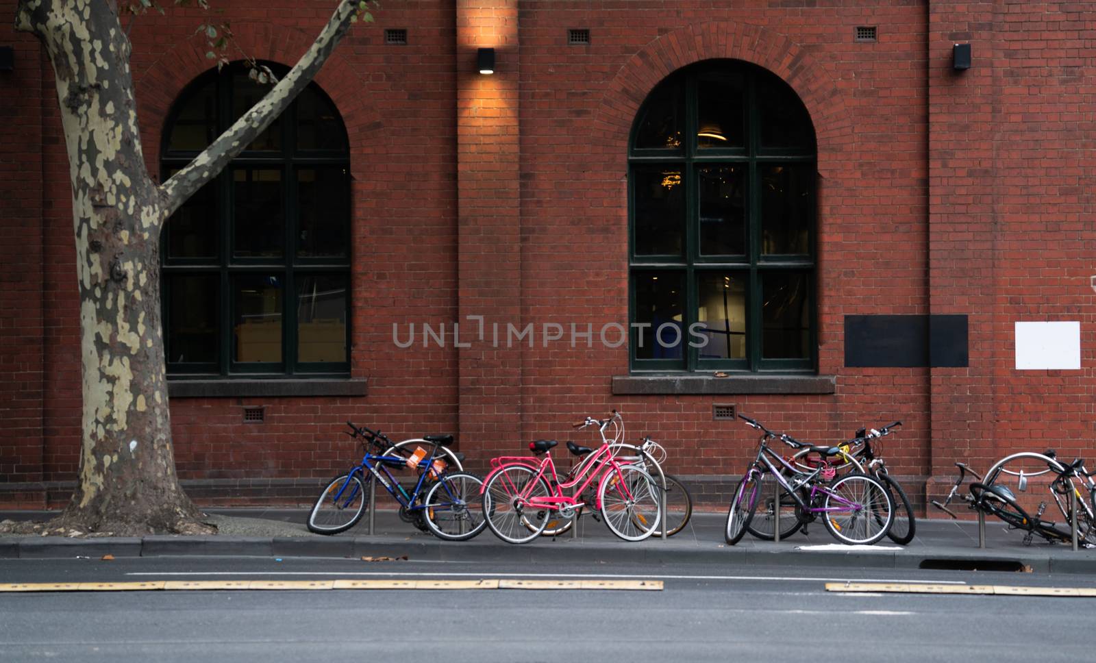 many bicycle parked in front of building