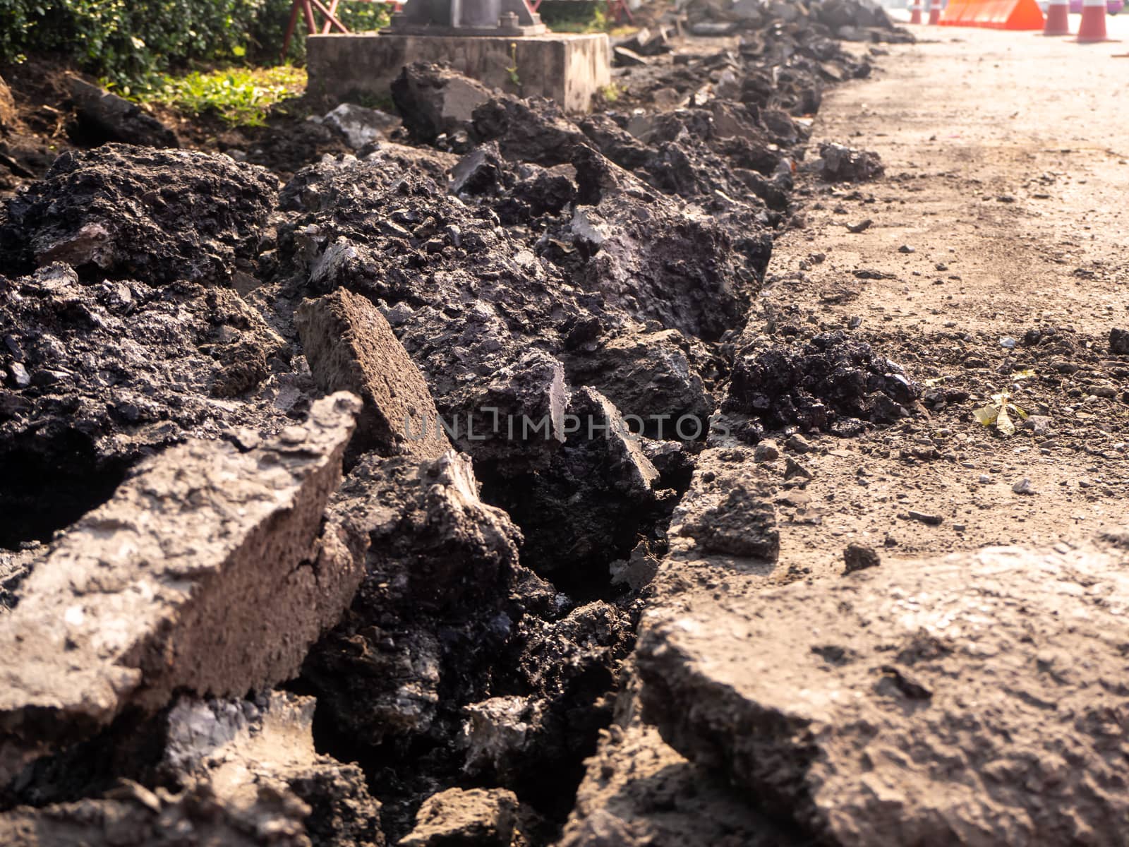 the Road repairing works with jackhammer. machine drills asphalt