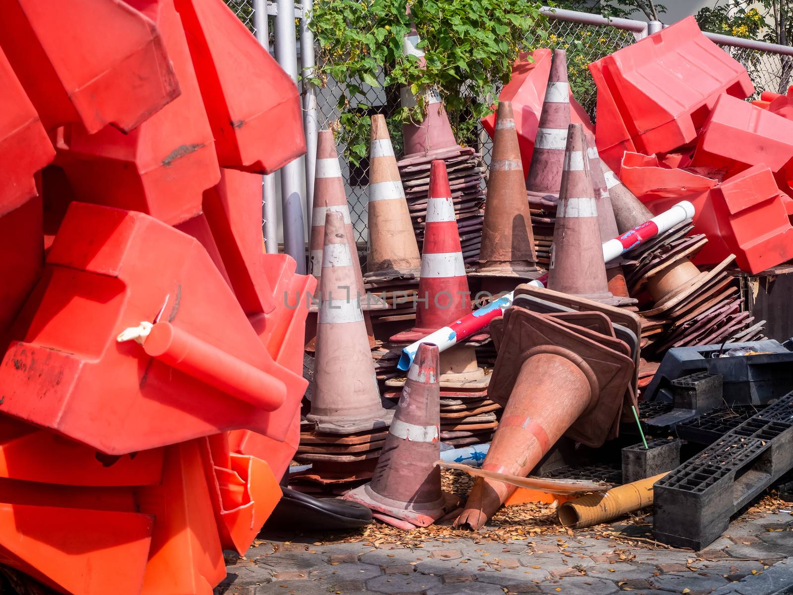 the orange traffic barrier barrels to detour traffic around construction zone shallow