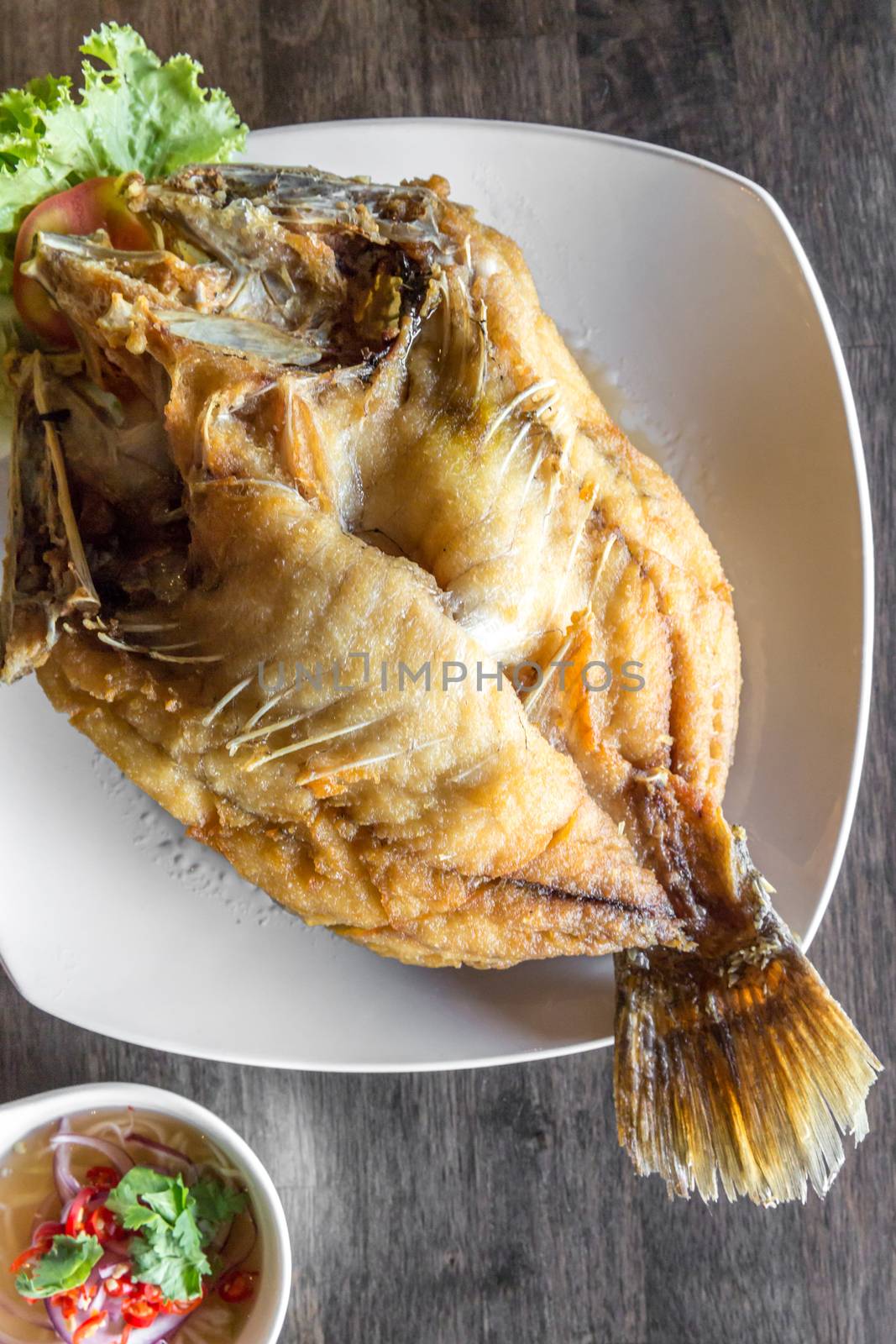 deep fried sea bass with fish sauce and spicy salad