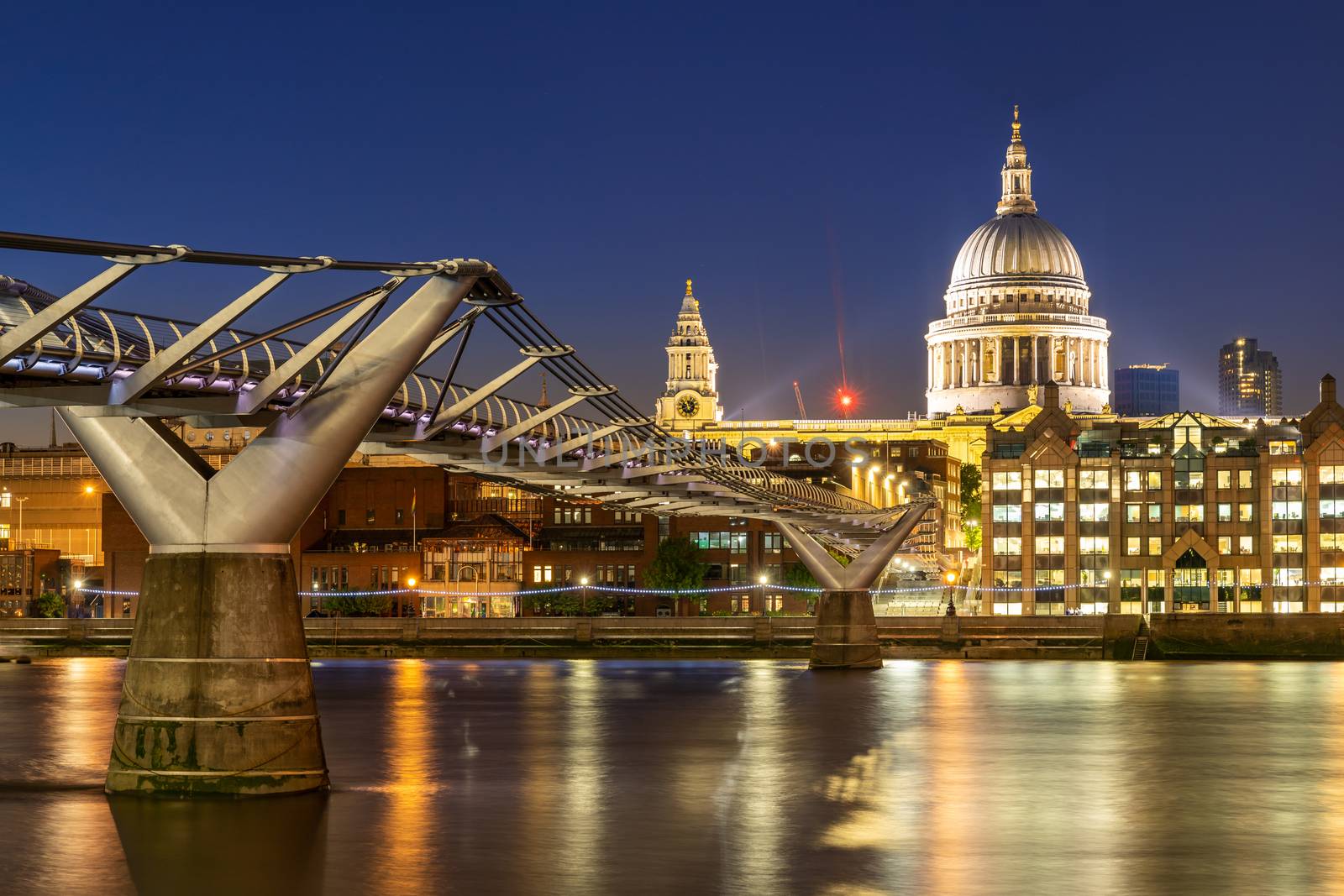 St paul cathedral with millennium bridge sunset twilight in London UK. 