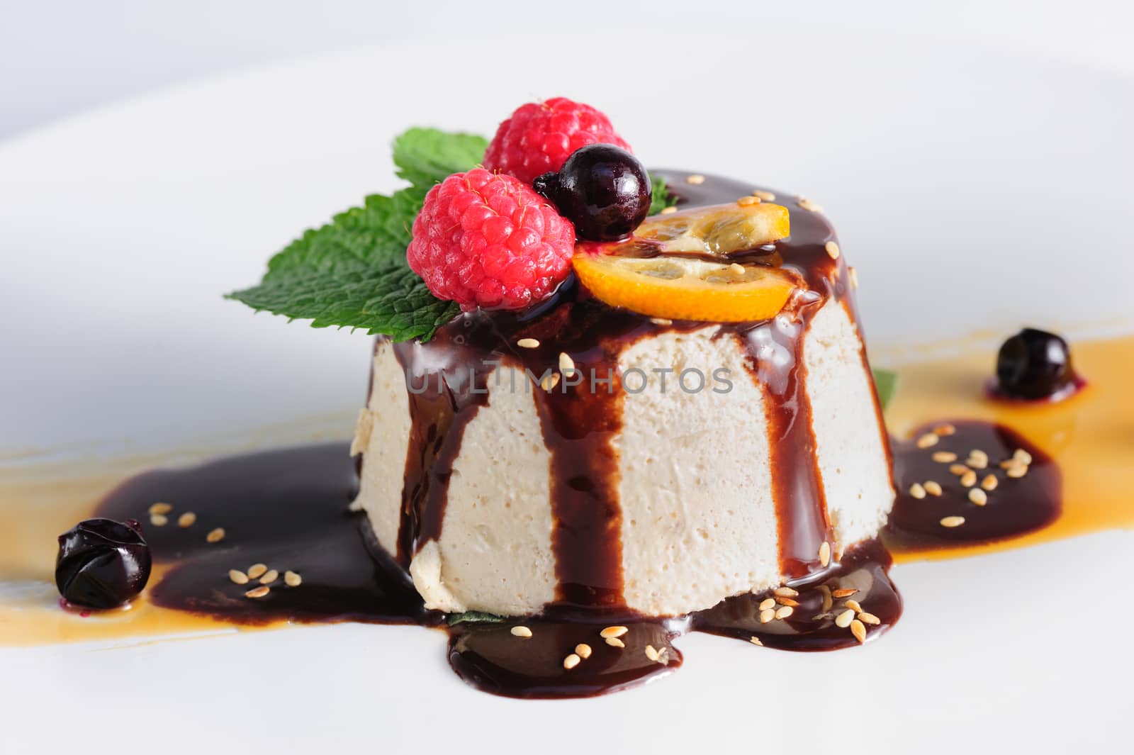 semifredo, italian ice cream dessert with halva, raspberry and chocolate sauce on top