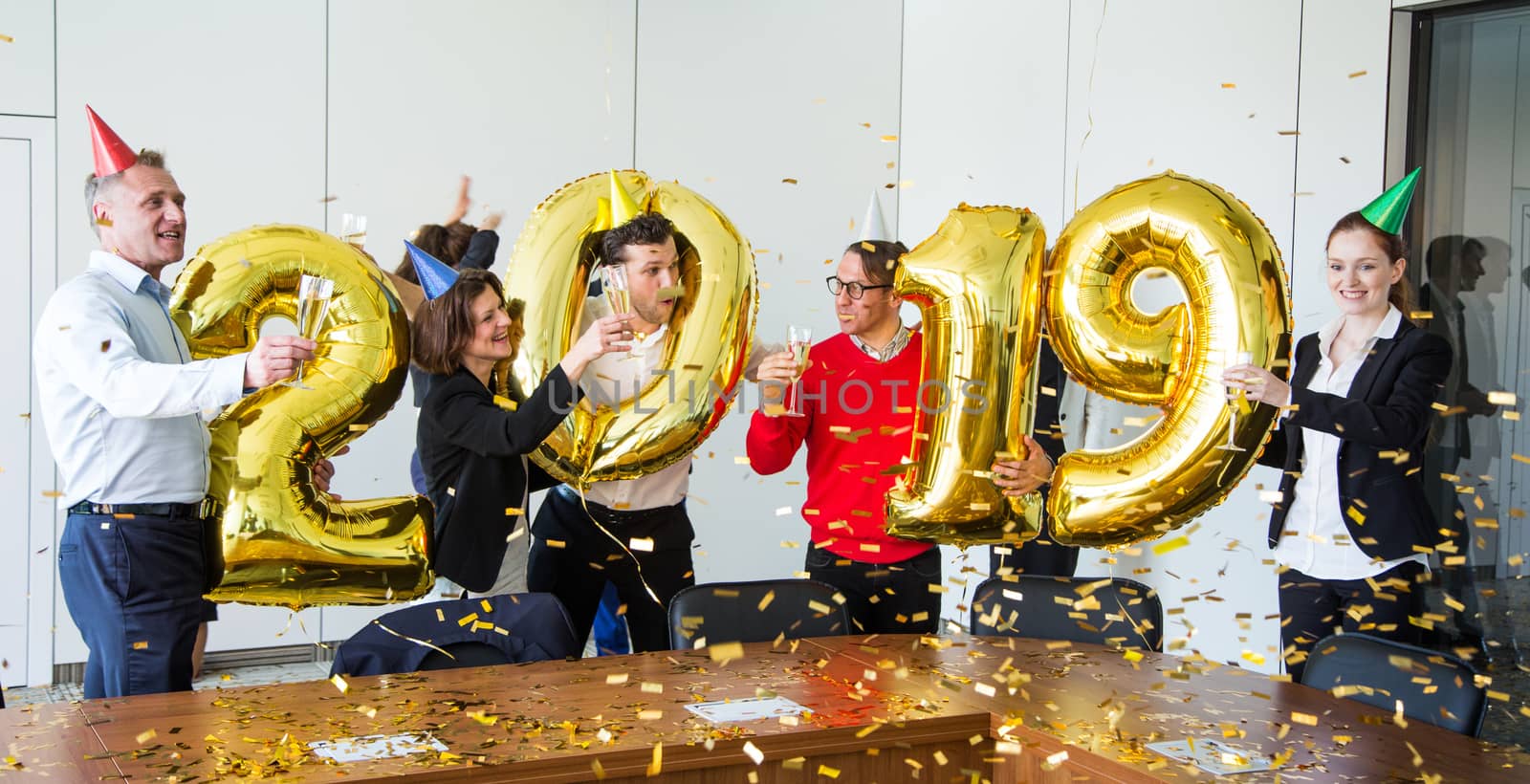 Business people celebrating 2019 New Year at office party