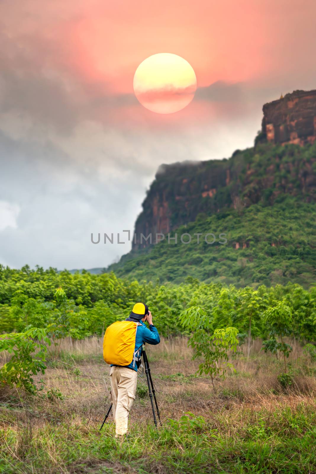 backpacker taking photos by rakratchada