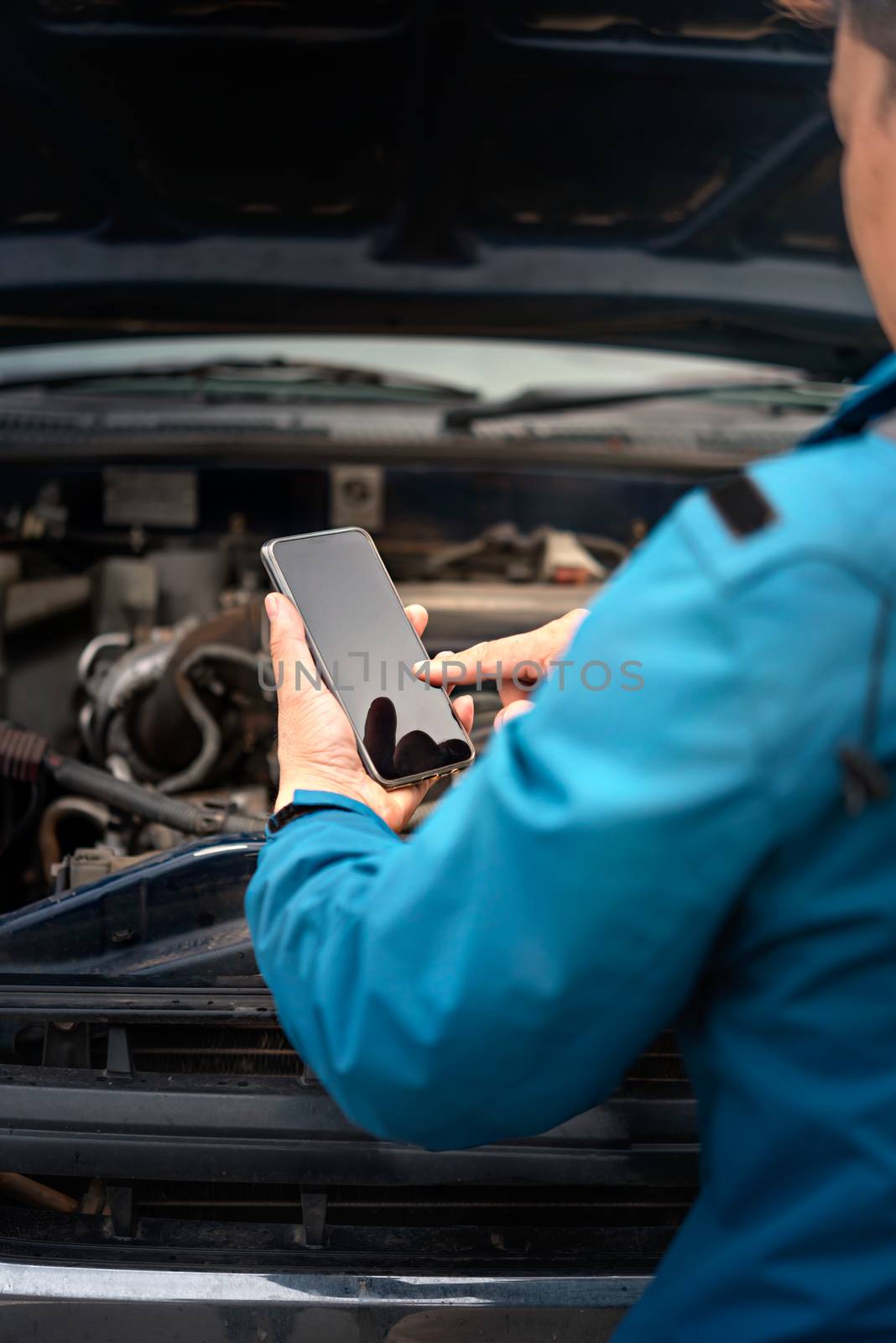 Motorist Broken Down On Country Road Phoning For Help