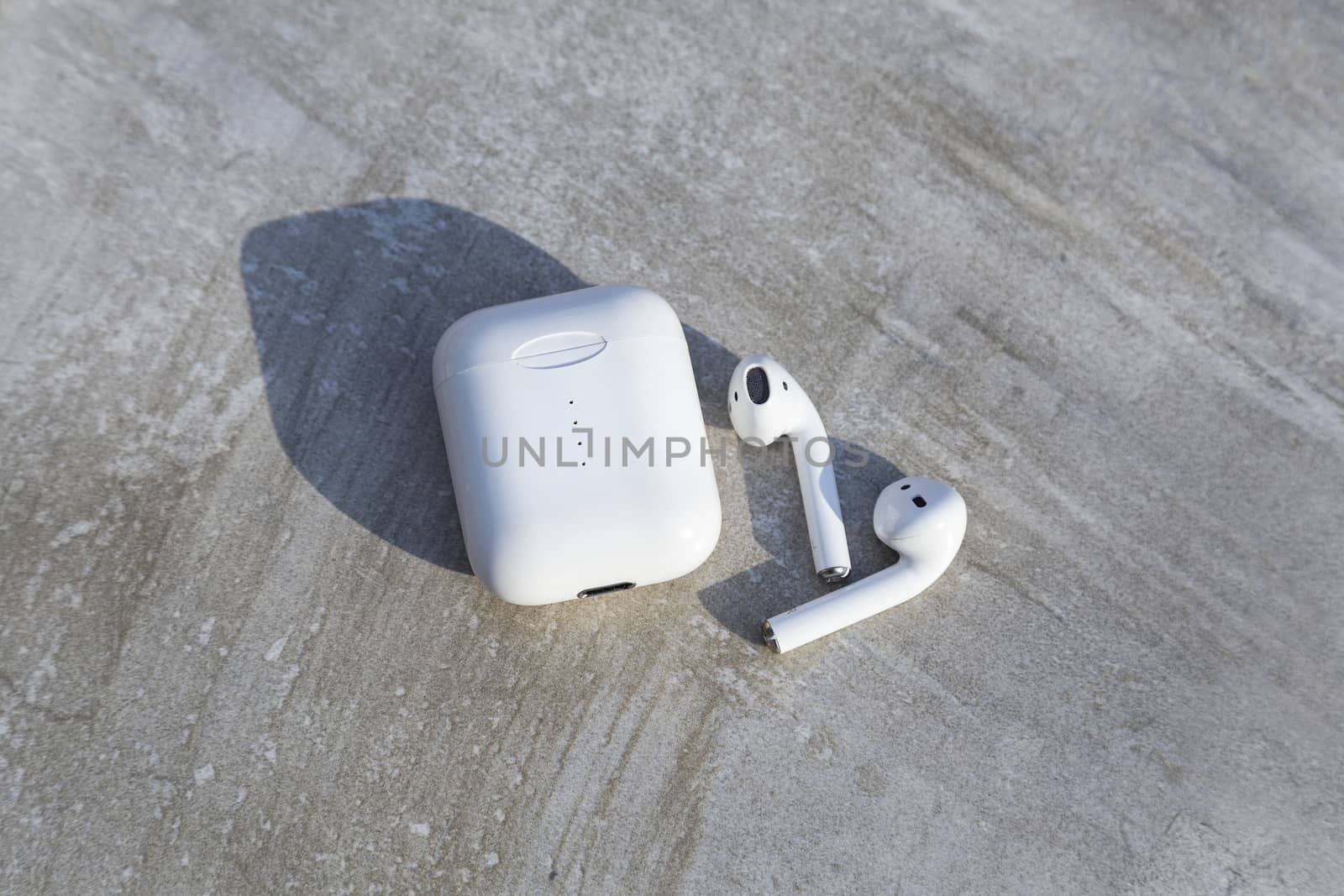 White Wireless Earphone with Case Top View Close Up Capture  by CristianDina