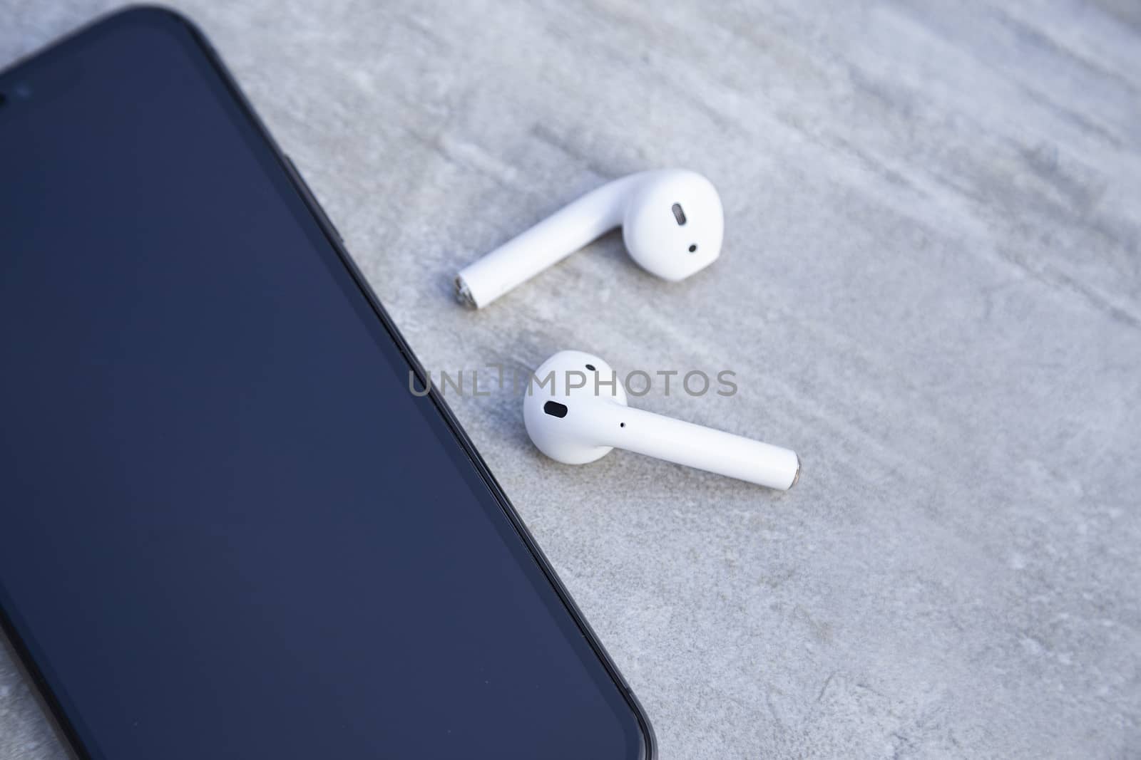 Black Luxury Smartphone with White Wireless Headphones by CristianDina