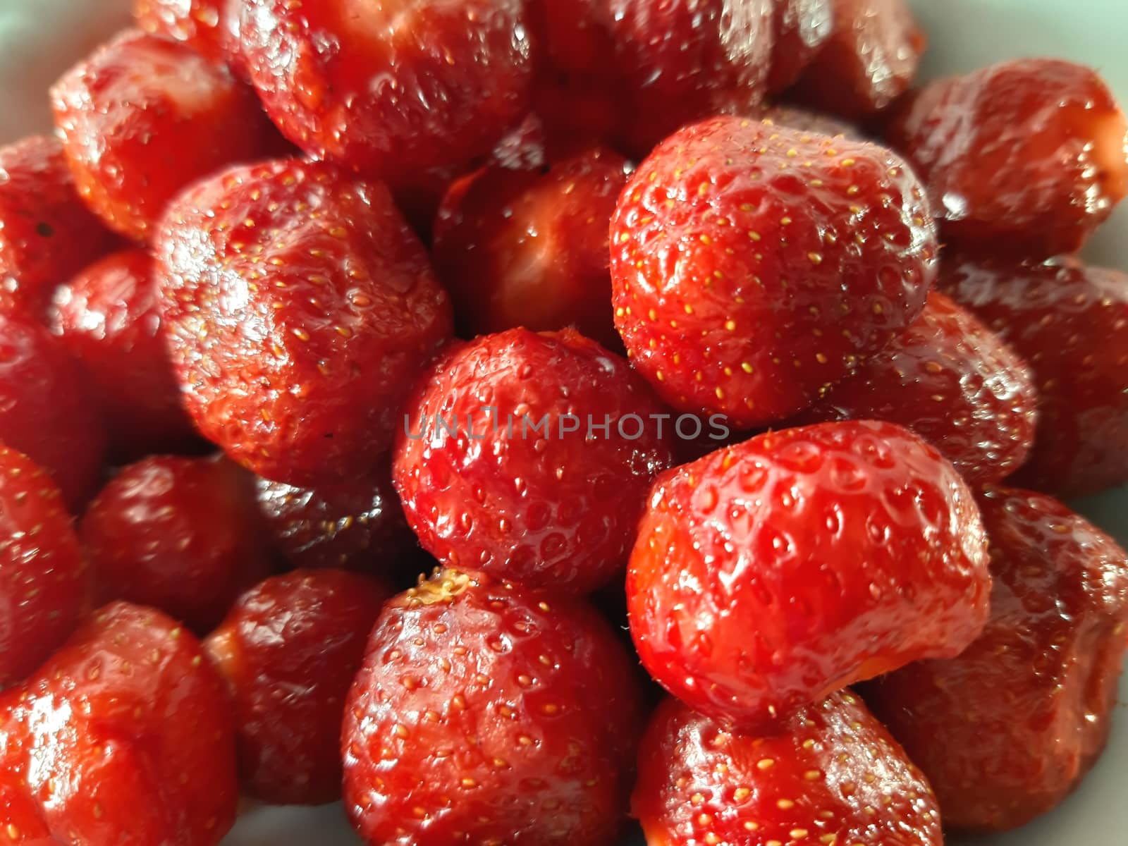 Colored fruit background. Strawberries close up. Photo of useful by polyachenkovv@gmail.com
