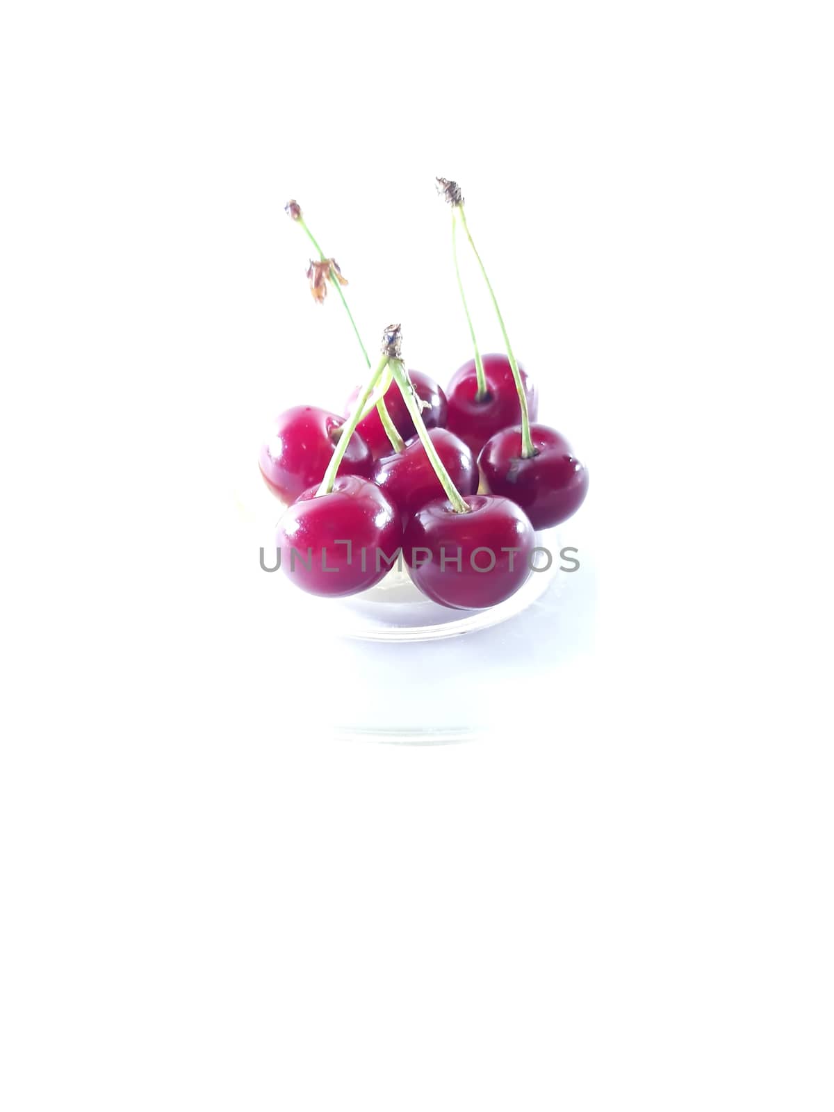 Photo cherry on a transparent plate. Healthy food. Vegetarian re by polyachenkovv@gmail.com