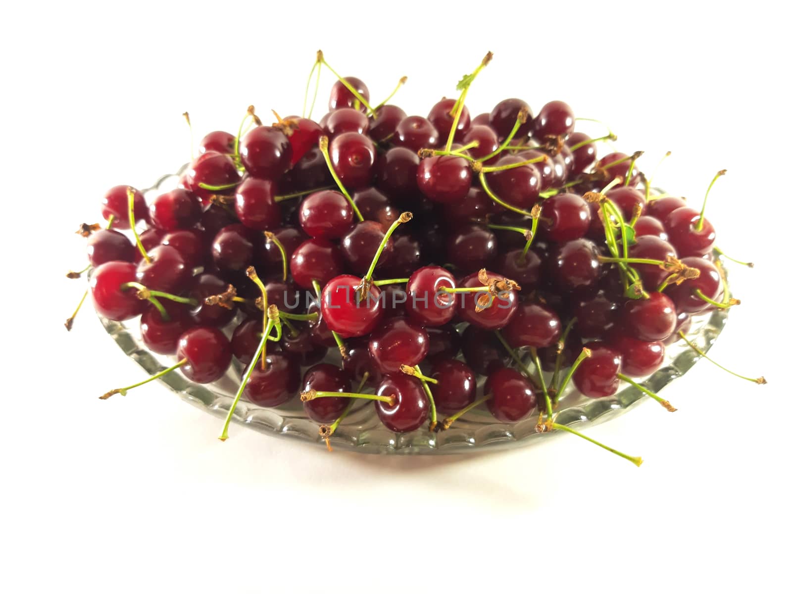 Photo cherry on a transparent plate. Healthy food. Vegetarian re by polyachenkovv@gmail.com