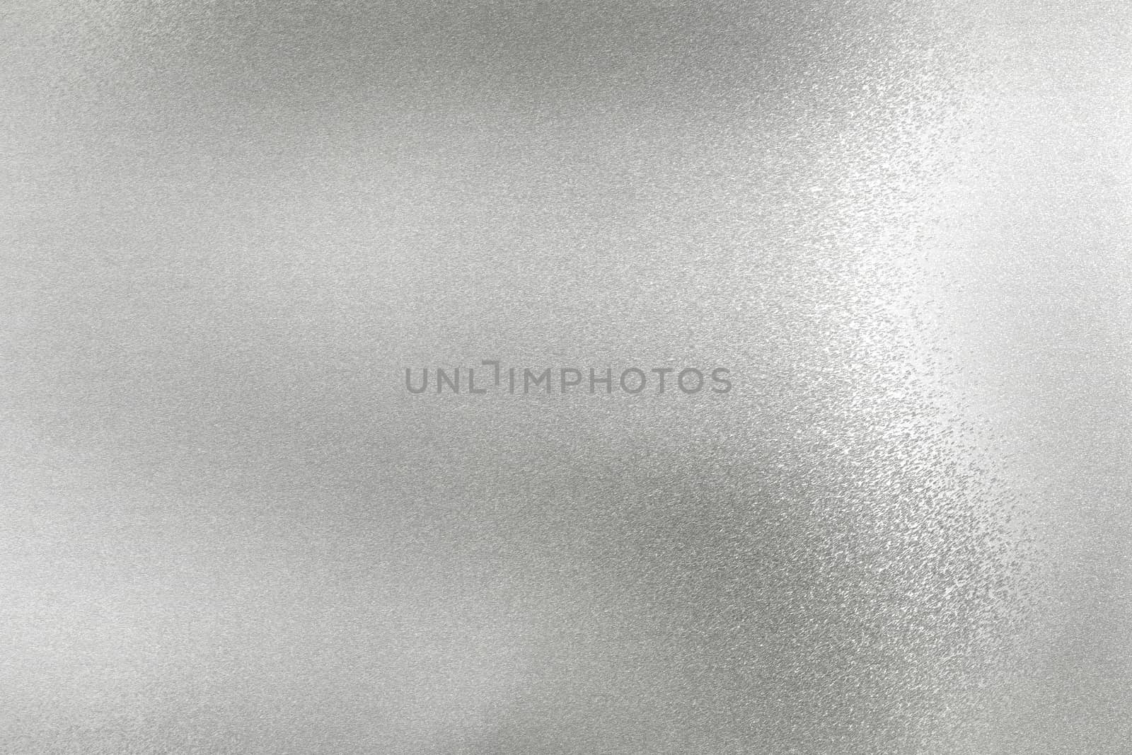 Glowing silver foil metal wall surface, abstract texture background
