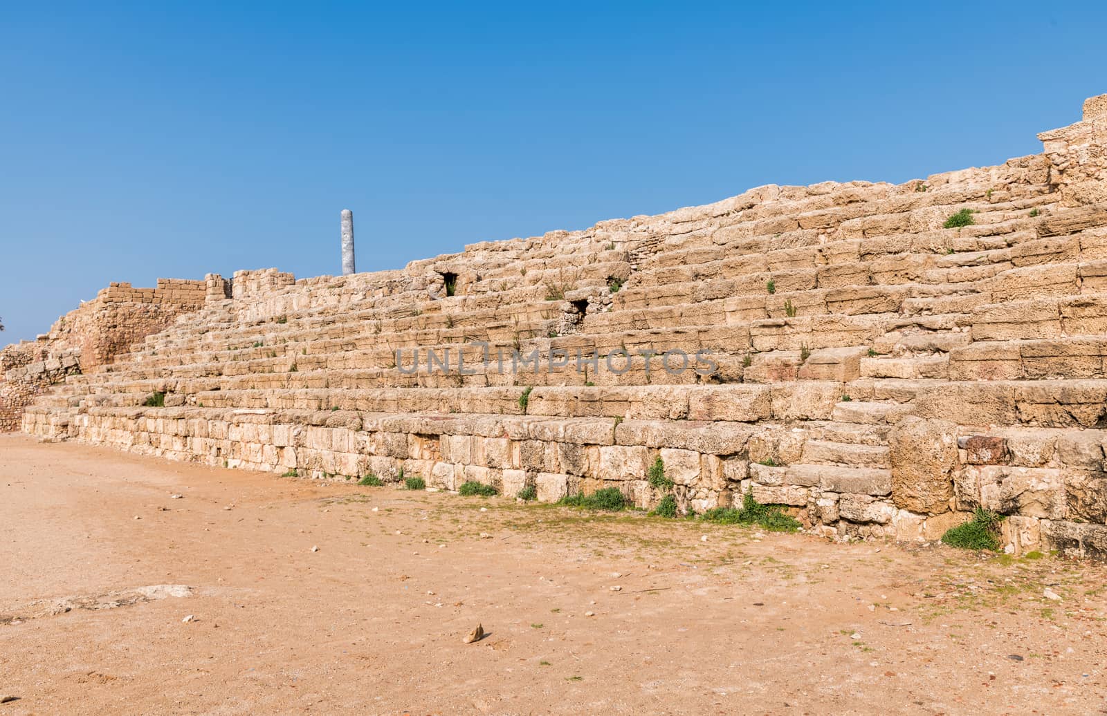 Fragment of the old tribunes of the arena at the ruined city of Caesarea in israel