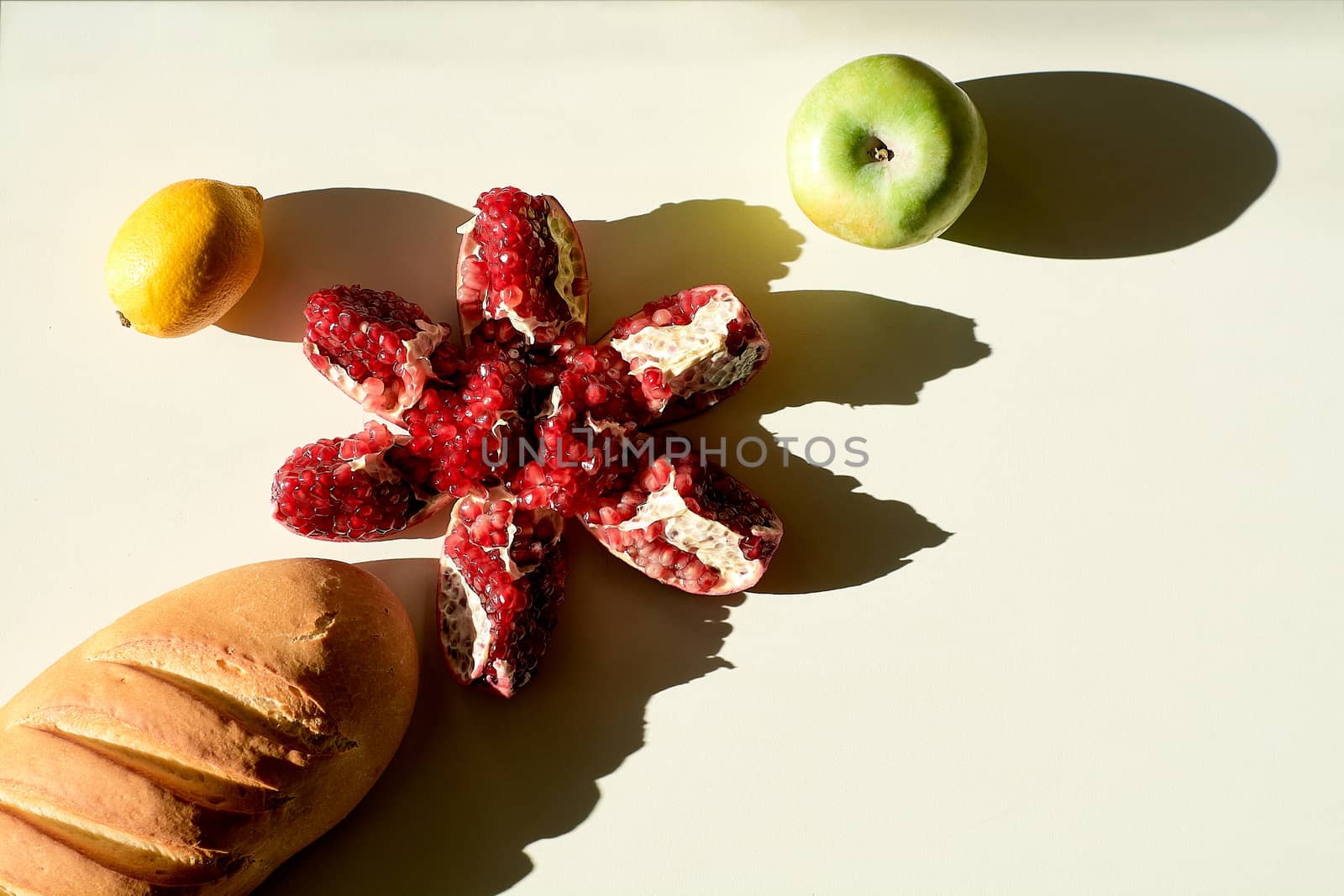 Garnet. Bread. Lemon. Apple. Grains pomegranate fruit. by nixrenas