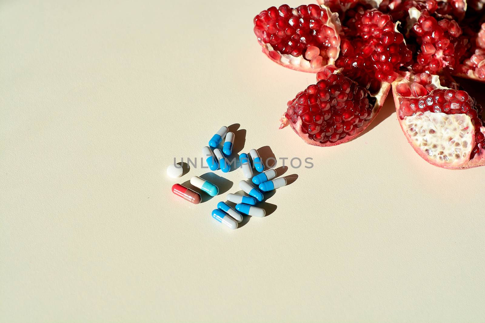 Pomegranate, tablets and capsules, pills. Concept of a healthy life. by nixrenas