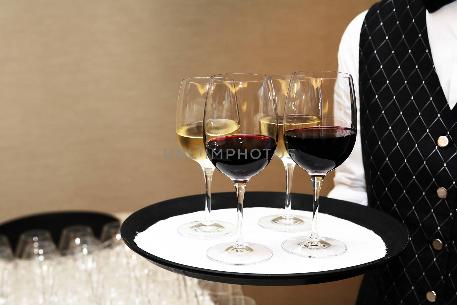 Cocktail party. Waiter holding platter with wineglasses