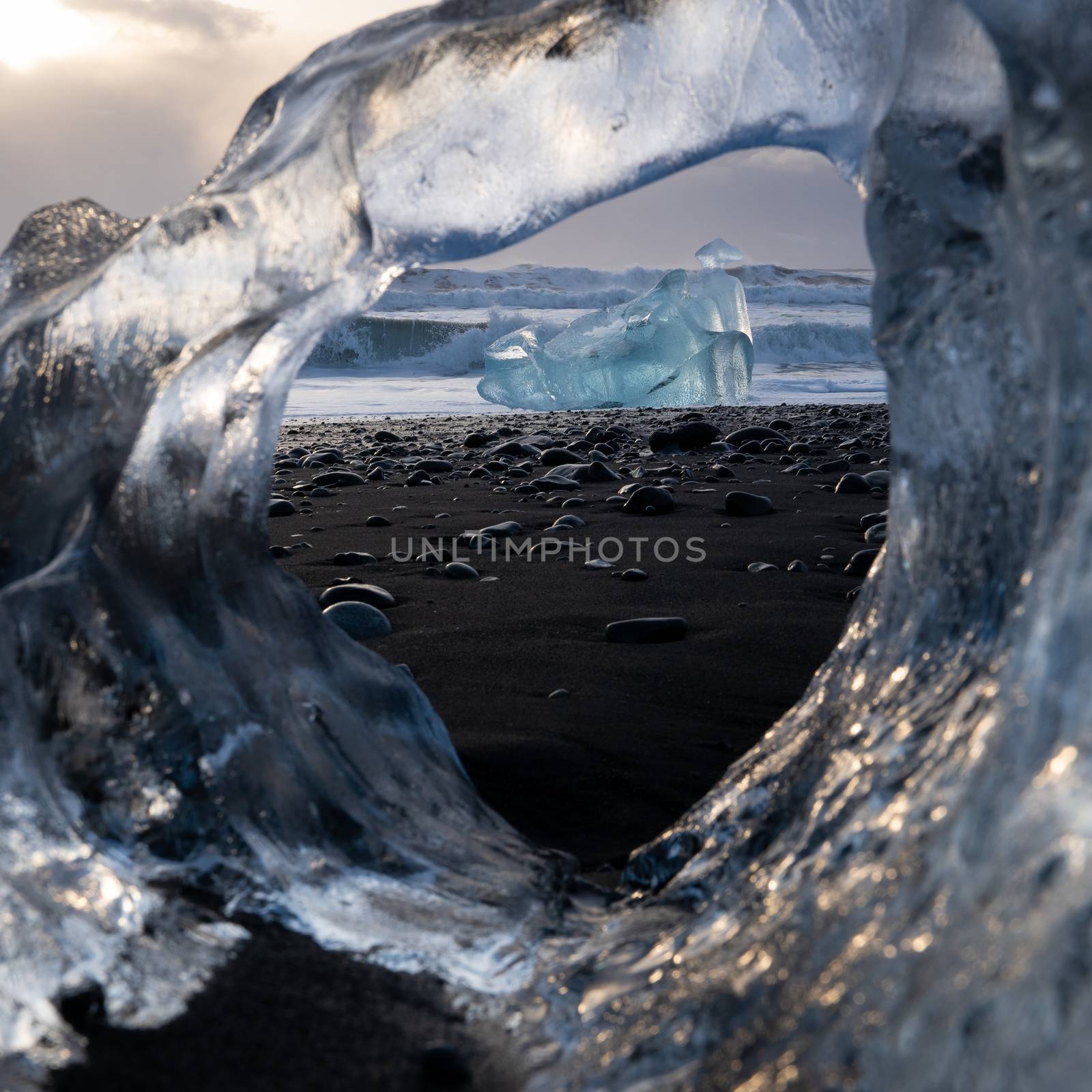 Icebergs at the black sand Diamond Beach with the sea in the background, Joekulsarlon, Iceland