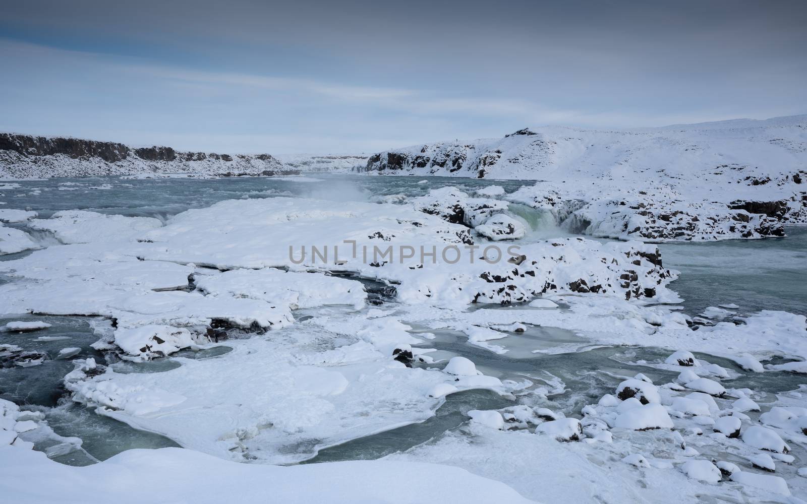 Panoramic image of the frozen waterfall Urridafoss, Iceland, Europe