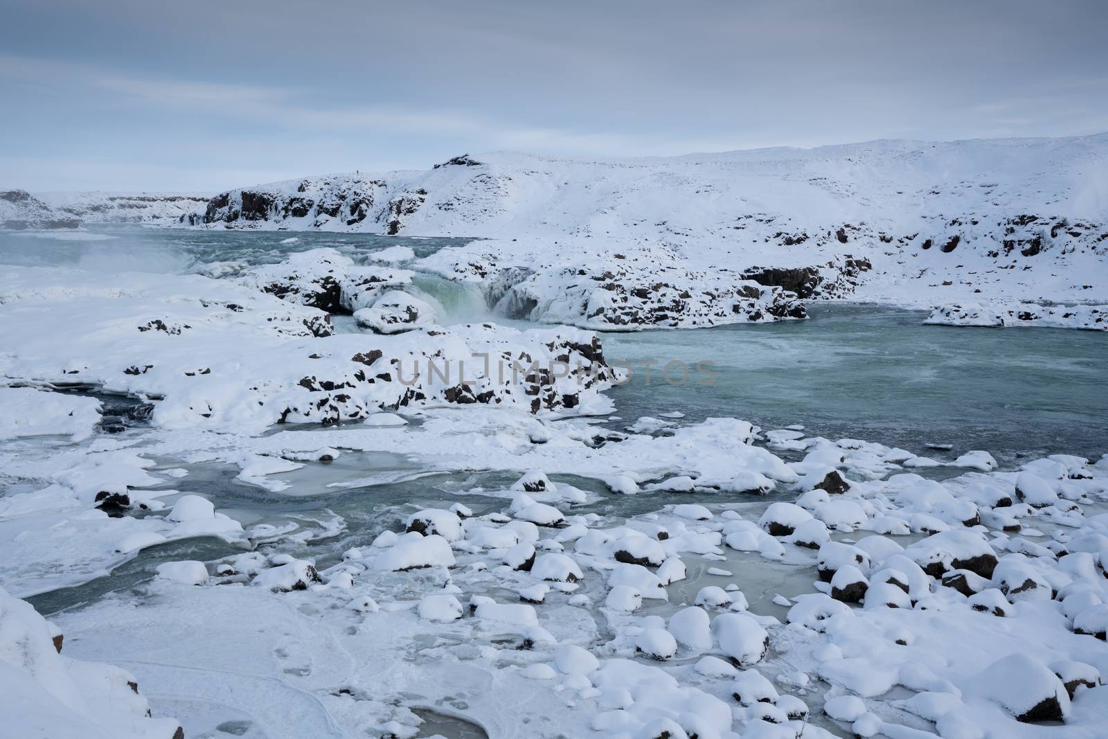 Panoramic image of the frozen waterfall Urridafoss, Iceland, Europe