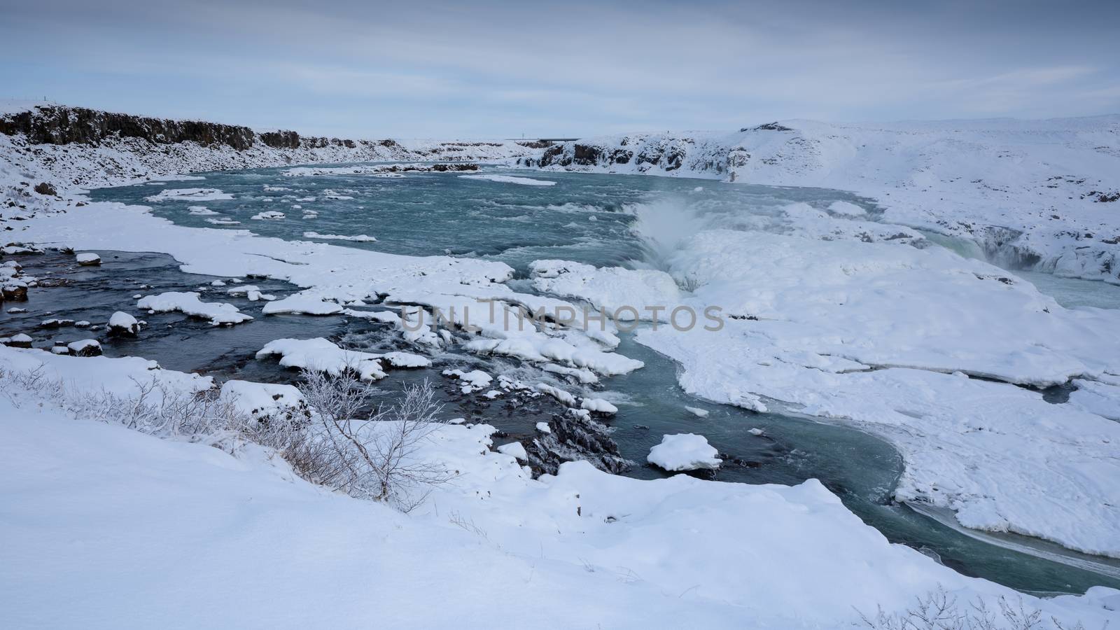 Panoramic image of the frozen waterfall Urridafoss, Iceland, Europe