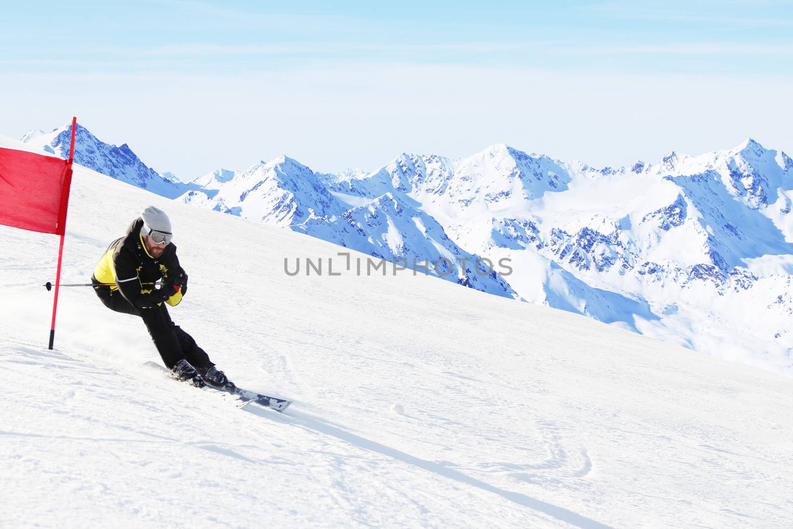 Giant Slalom ski racer skiing downhill in high mountains, Solden, Austria