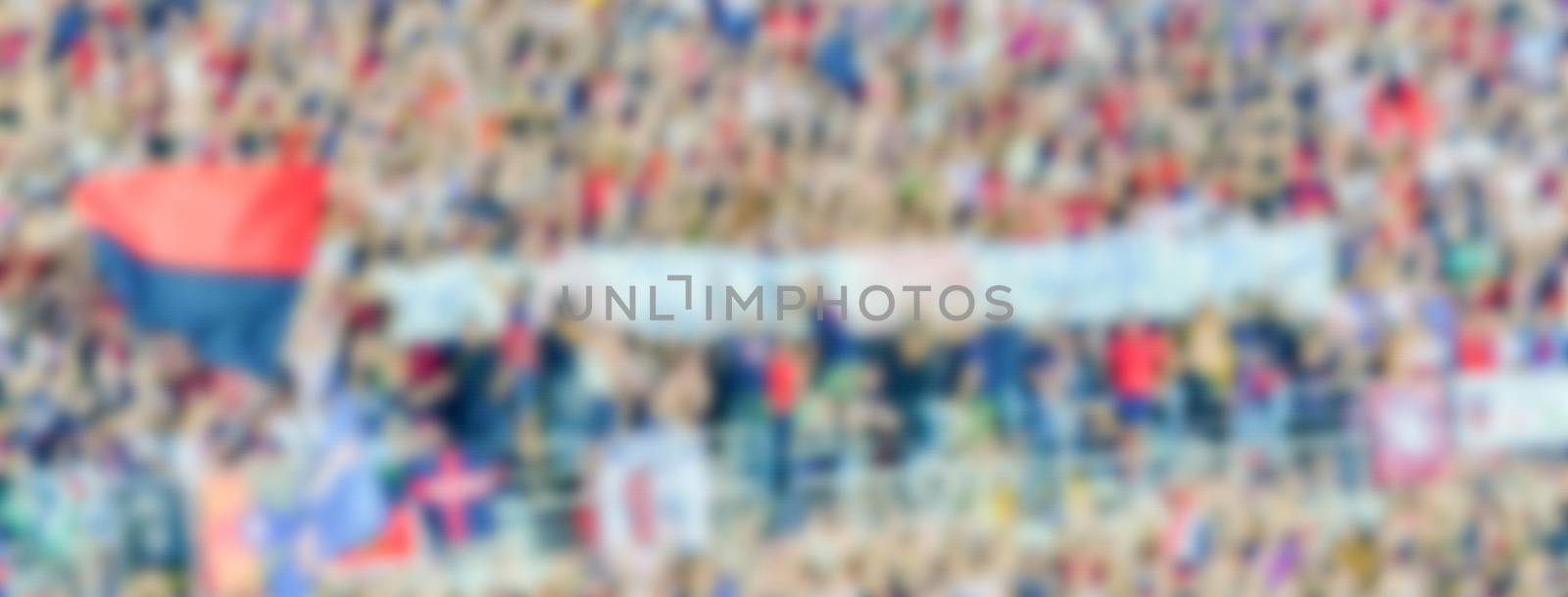 Defocused background with supporters in the stadium for football by marcorubino