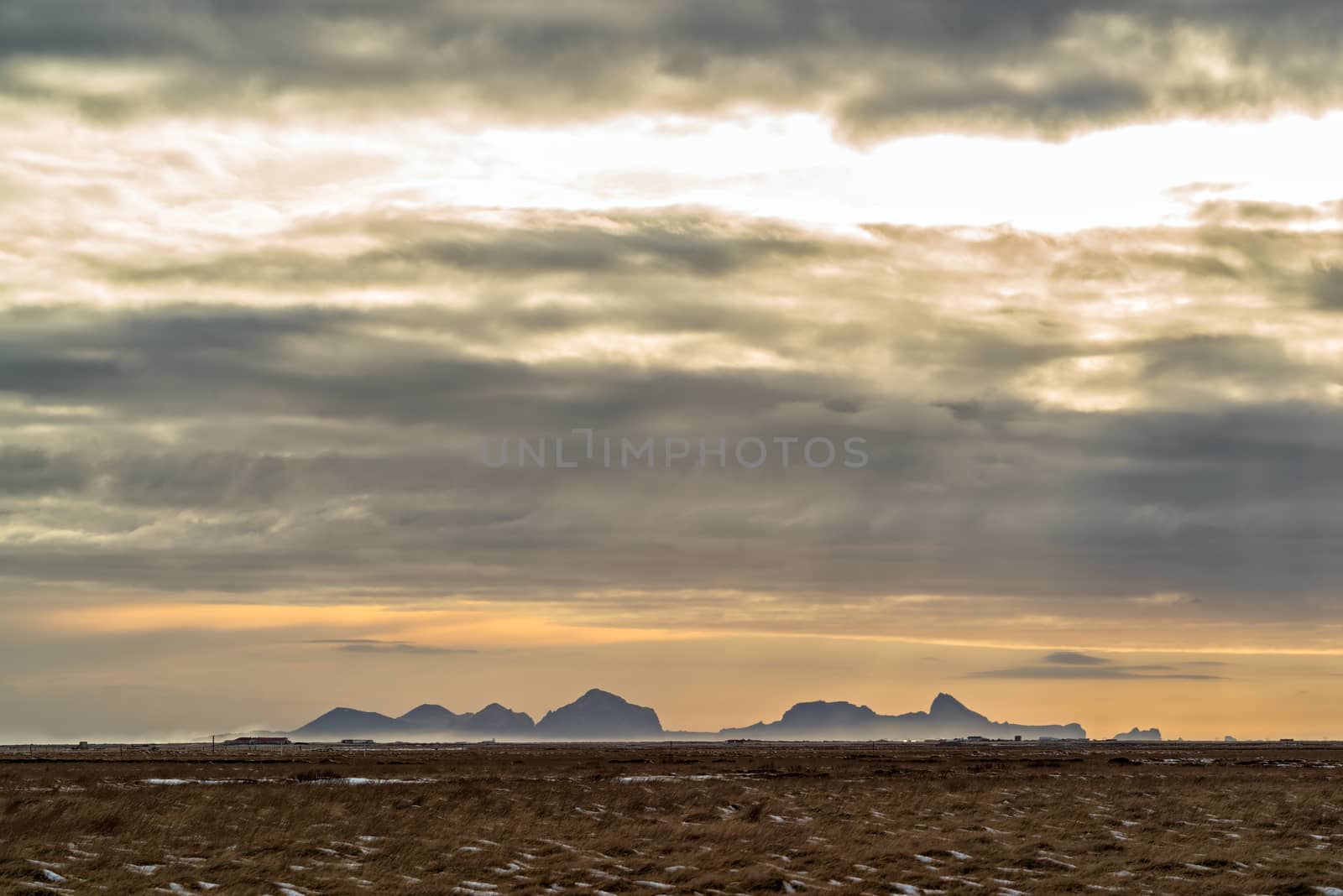 Bay and mountains of Vik in distance, Iceland by LuigiMorbidelli