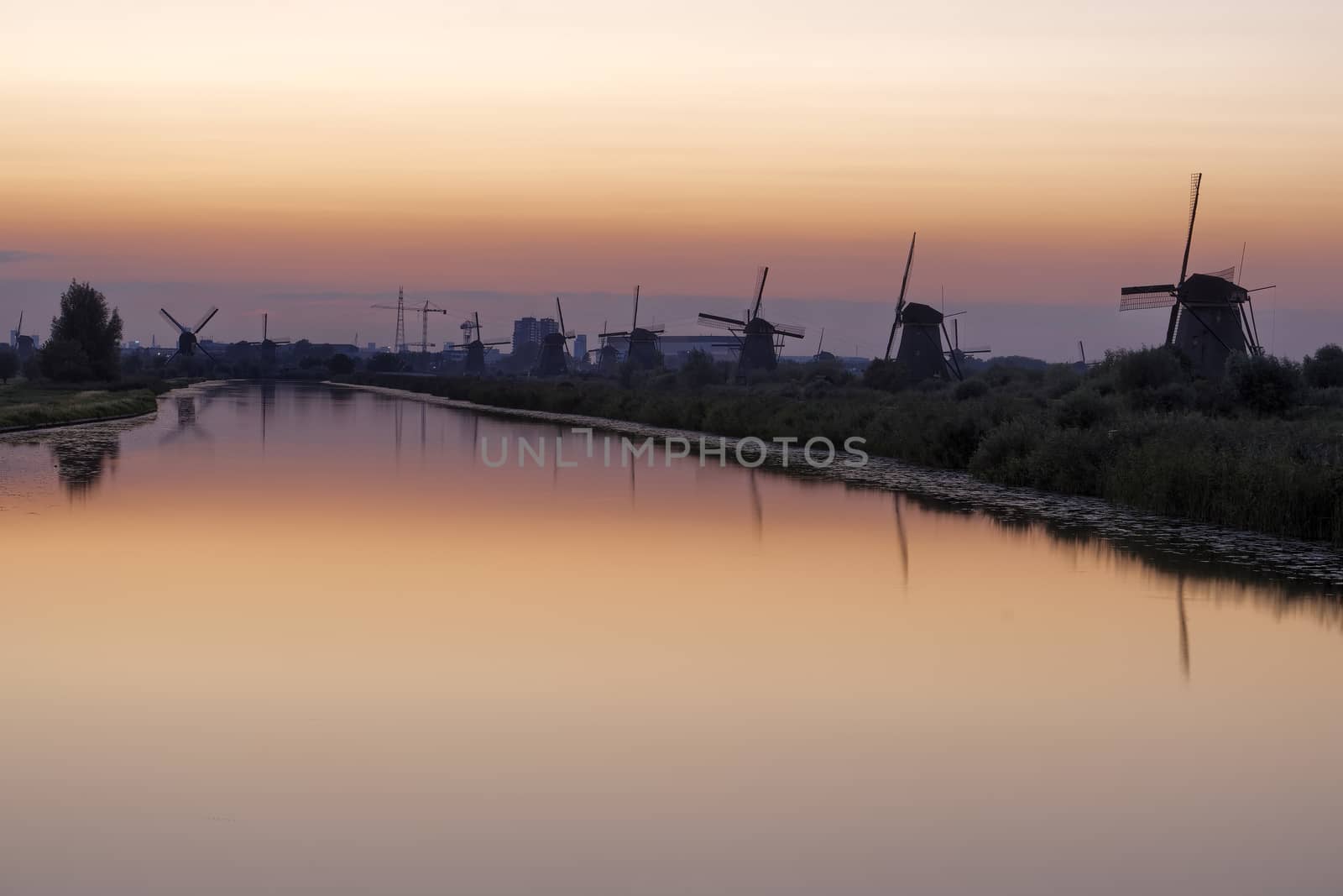 Historic windmills at Kinderdijk, The Netherlands, in beautiful twilight.