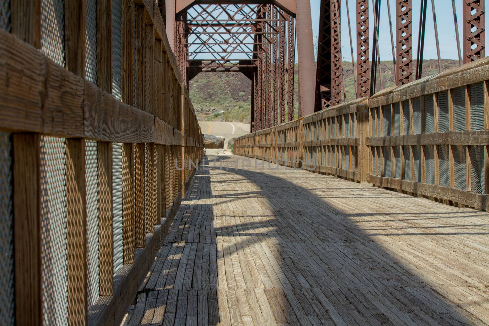 Path of a wooden bridge leading off into the distance