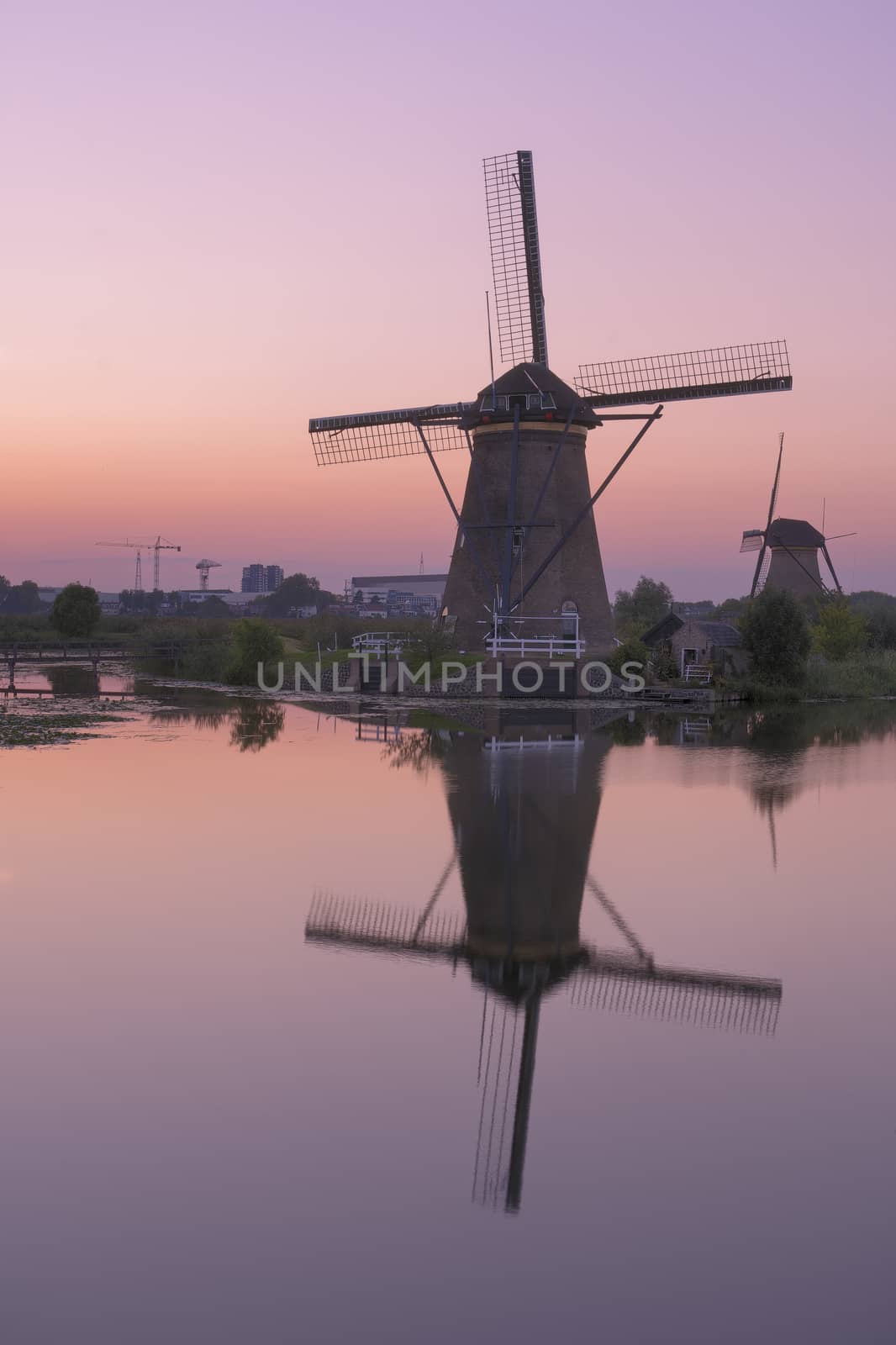 Historic windmills at Kinderdijk, The Netherlands, in beautiful twilight.