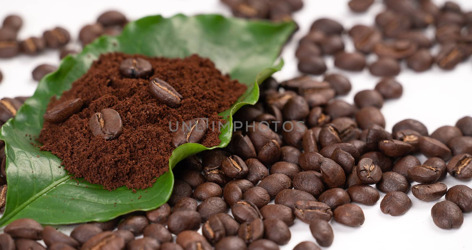 roasted coffee bean with leave isolated on white background