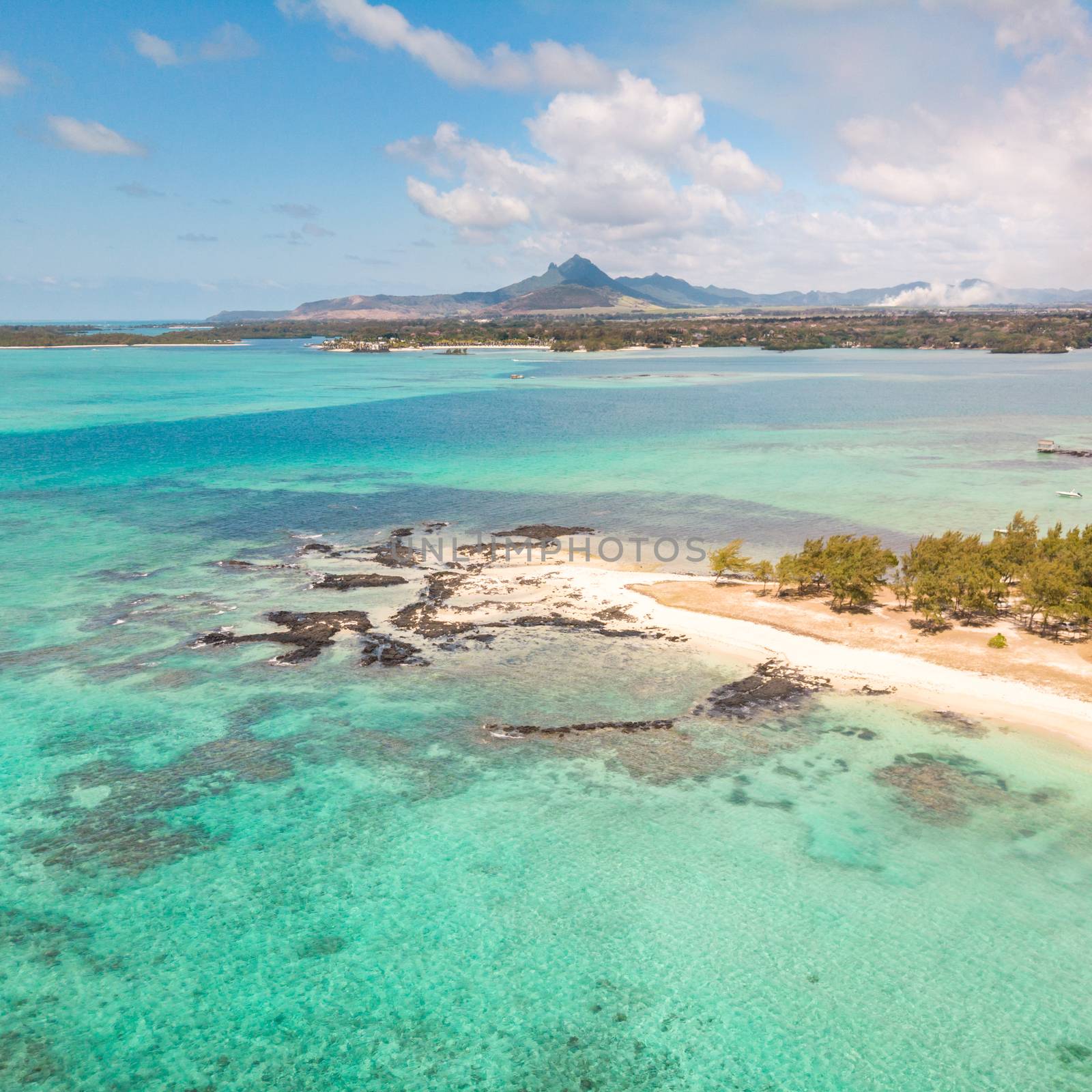 Aerial view of beautiful tropical beach with turquoise sea. Tropical vacation paradise destination of D'eau Douce and Ile aux Cerfs Mauritius