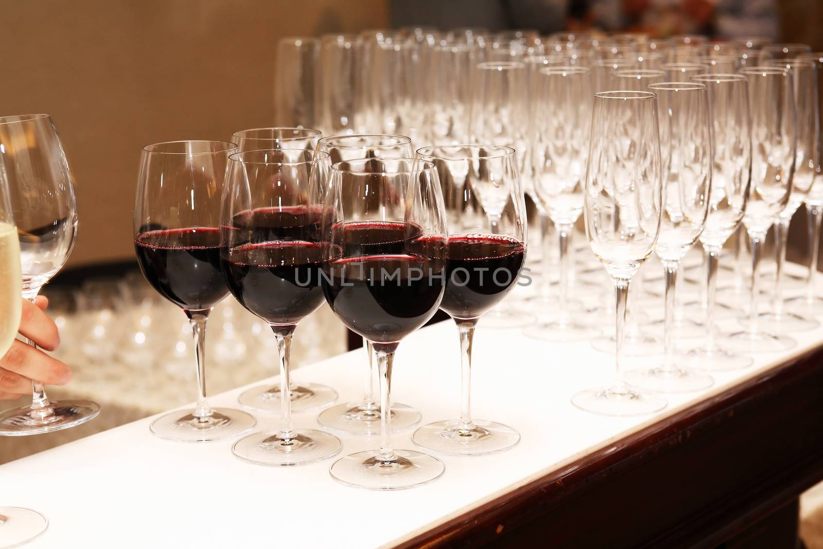 Cocktail party. Bar counter with red wine for company