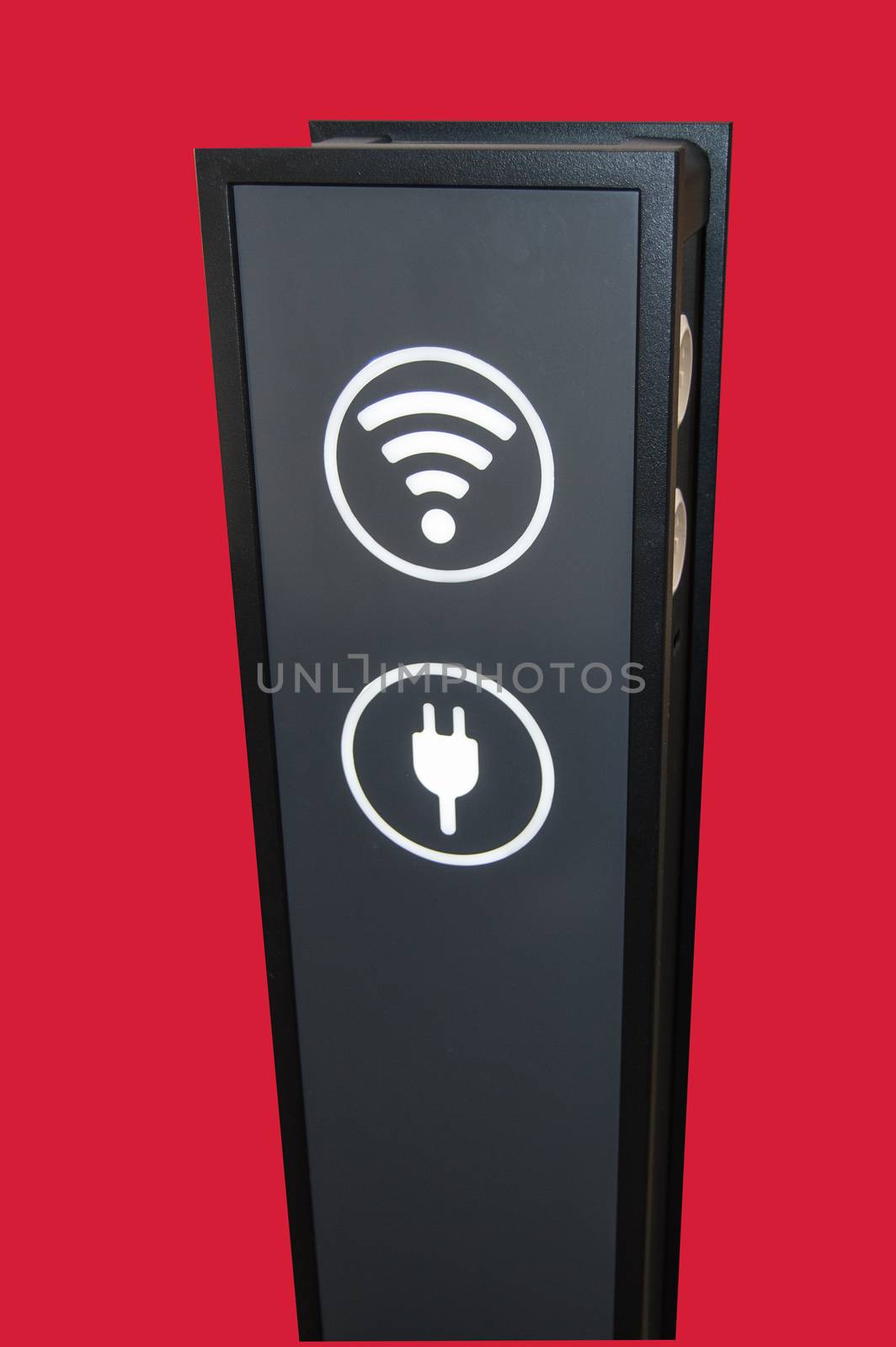 Stand tower for charging mobile phones in shopping Mall, wifi zone sign isolated on red background by clipping, vertical shot.