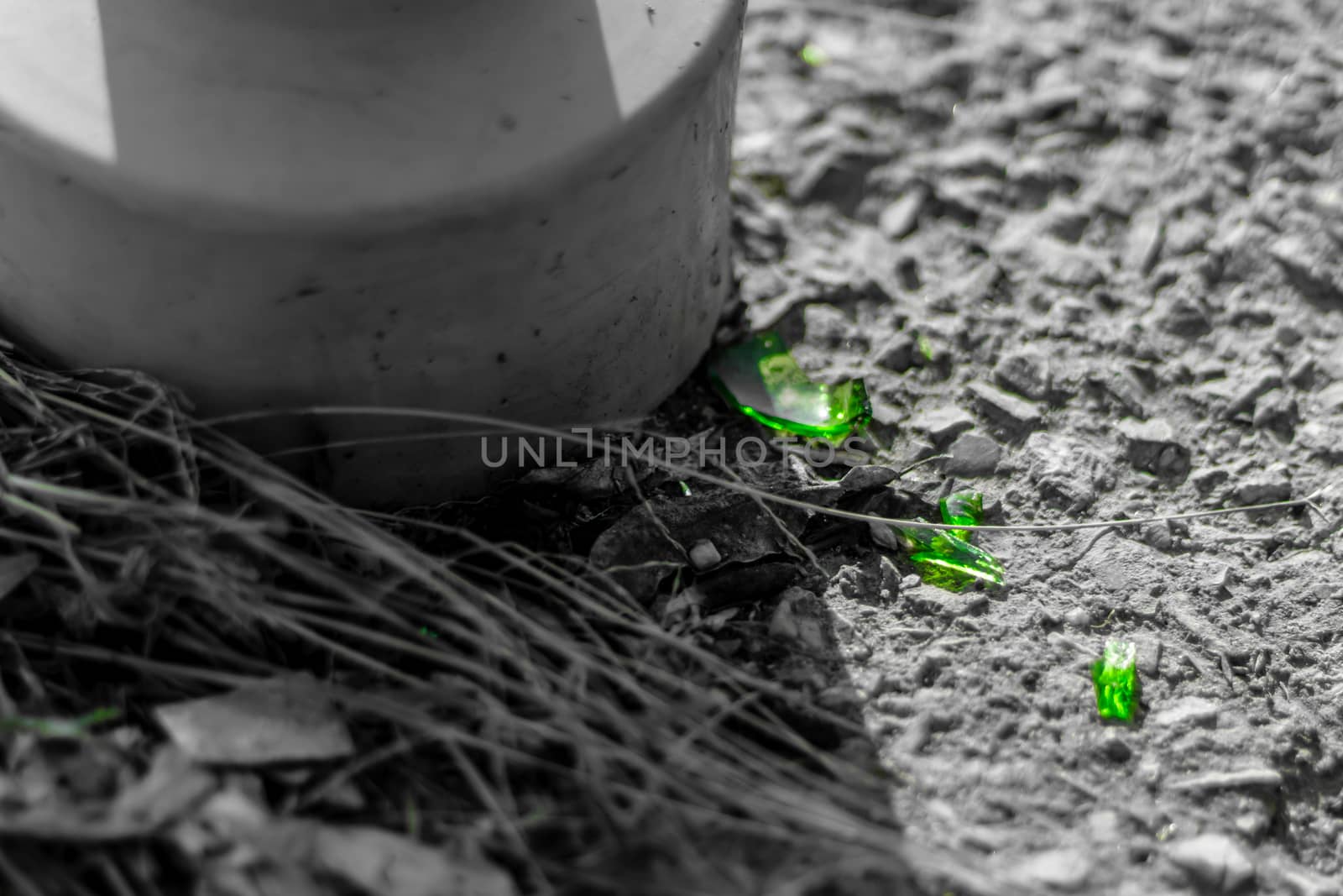 closeup shoot of broken glass pieces on stone floor. photo has taken at izmir/turkey.