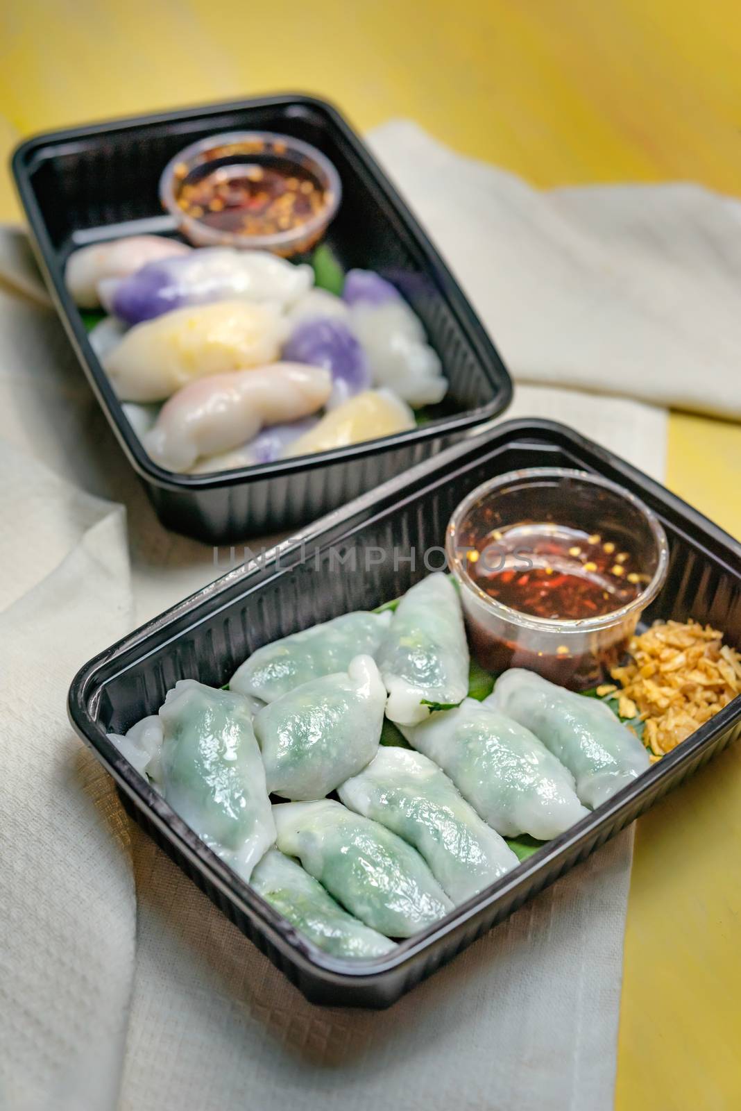 steamed chives dumplings served with spicy chili sauce , asian style cuisine