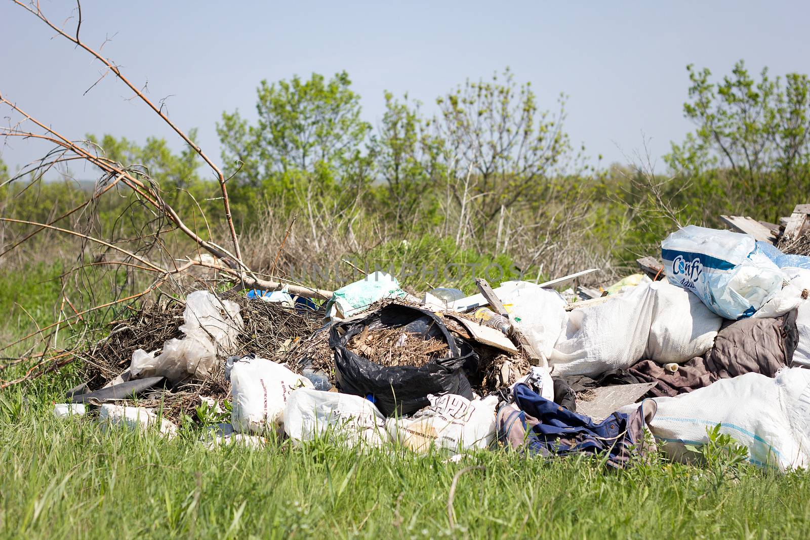 garbage dump in the field. Environmental pollution. Global probl by kasynets_olena