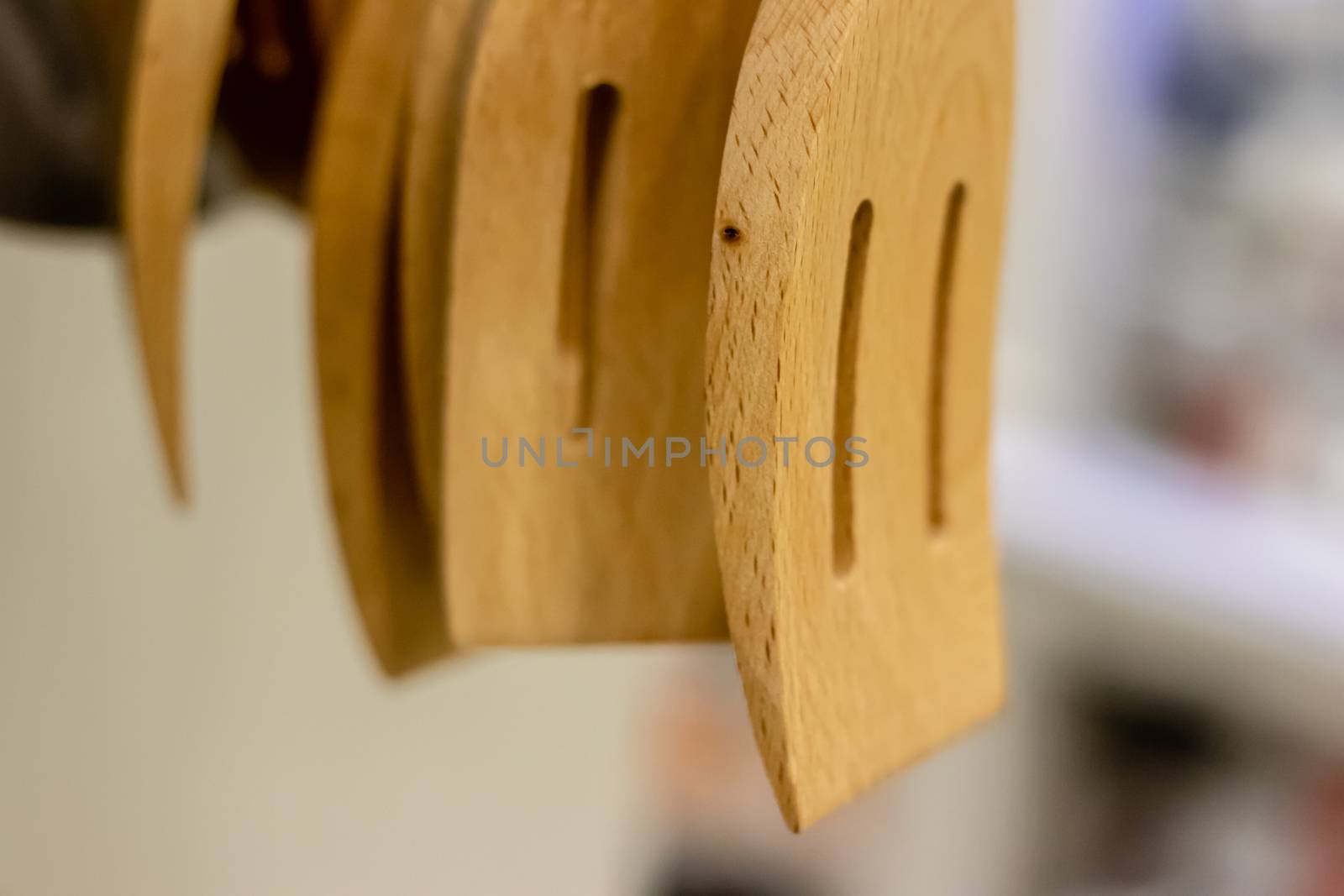 closeup shoot from three wooden scraper - background is blurry. photo has taken with white lightning.