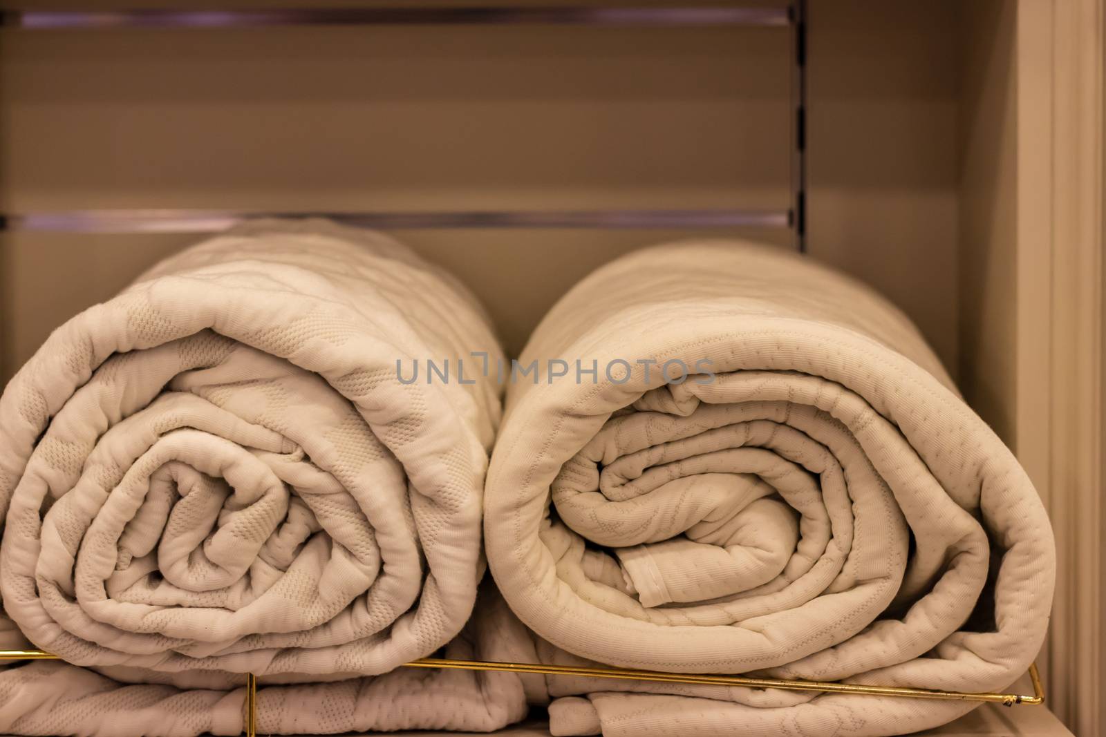 closeup shoot from two good looking linen towel rolls. photo has taken under white lightning.