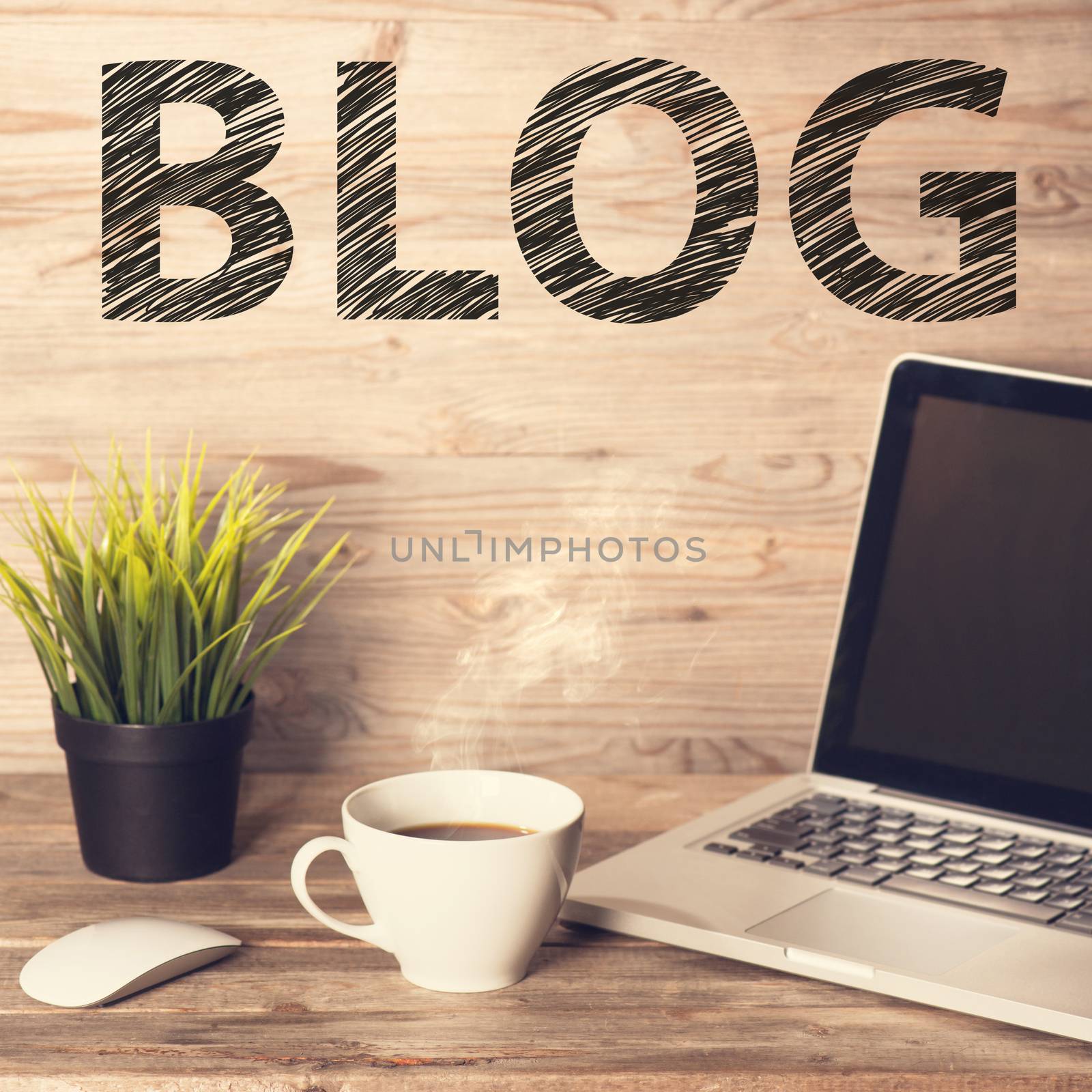 Blog text with computer keyboard, cup of coffee and plant pot. Wooden table background in vintage toned.