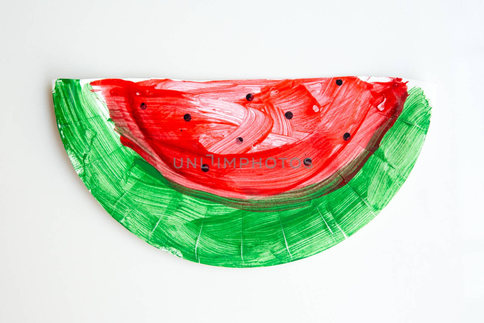 Child artwork, handmade watermelon on plain background.