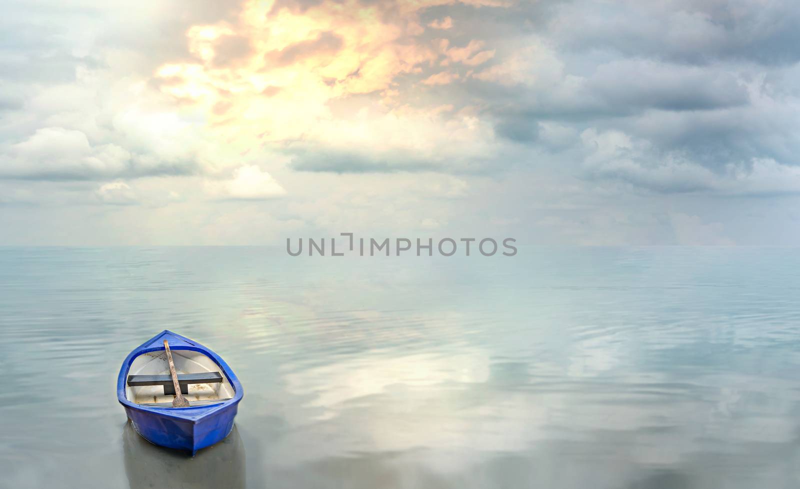 blue boat floating on the calm water by rakratchada